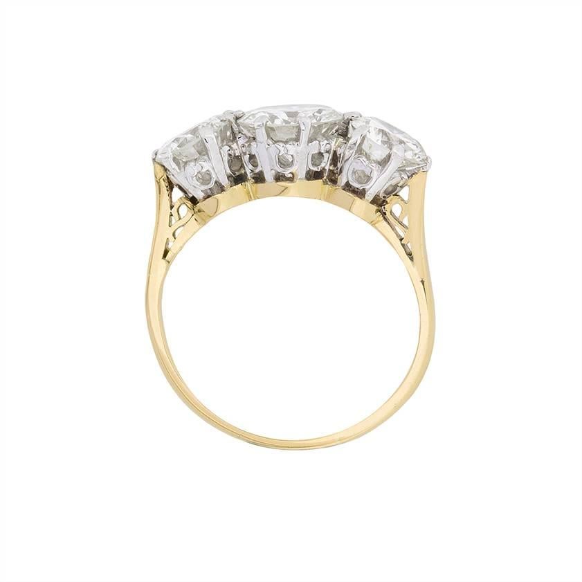 Hallmarked 1942 on the inside of the band, this three stone is a stunning vintage piece of jewellery. The total carat weight is 2.65 carat, and all three stones are transitional cuts. A transitional cut stone has features of both the older cut
