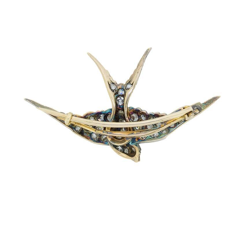This delicate brooch is in the shape of a swallow, and is a beautiful piece from the Victorian era. It features grain set, old cut diamonds which make up the body of the bird, and the wings. The diamonds are estimated to be G-H colour and SI