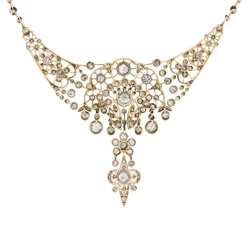A stunning set of state jewellery, dating back to the 1880s. Typically Victorian and elegant in style, this necklace and earrings are of British Provenance. In the centre of the necklace, you have a beautifully set 2.60 carat old cut diamond within
