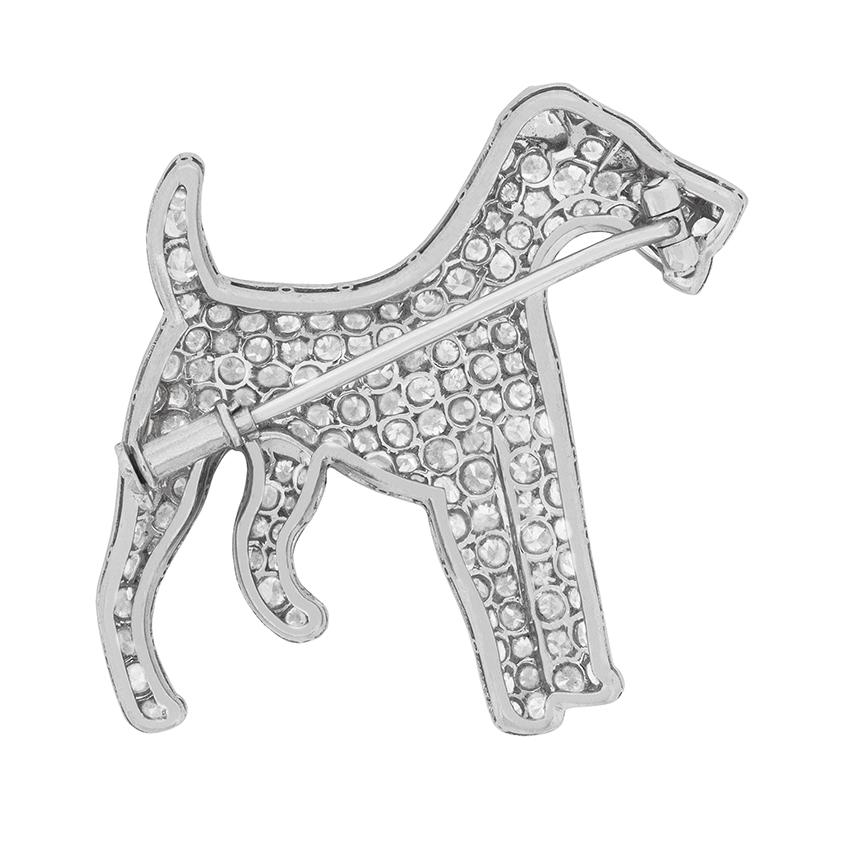 This gorgeous little brooch is an original piece dating back to the 1920s. There are approximately 165 eight cut diamonds, grain set within the body of the dog. They have an estimated total carat weight of 5.00 carat, and are E in colour and VS in