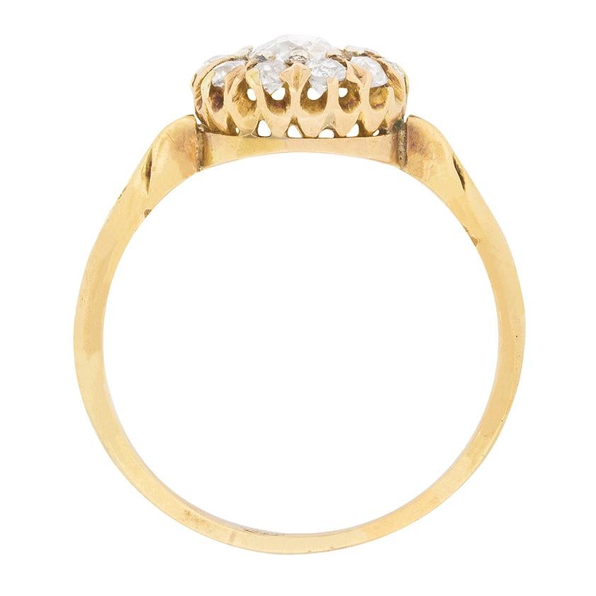 Dating back to the 1900s, this beautiful halo ring features a collection of old cut diamonds. The centre diamond weighs 0.60 carat and the ten in the halo each weigh 0.05 carat. This brings the total to 1.10 carats and they all match in quality. The