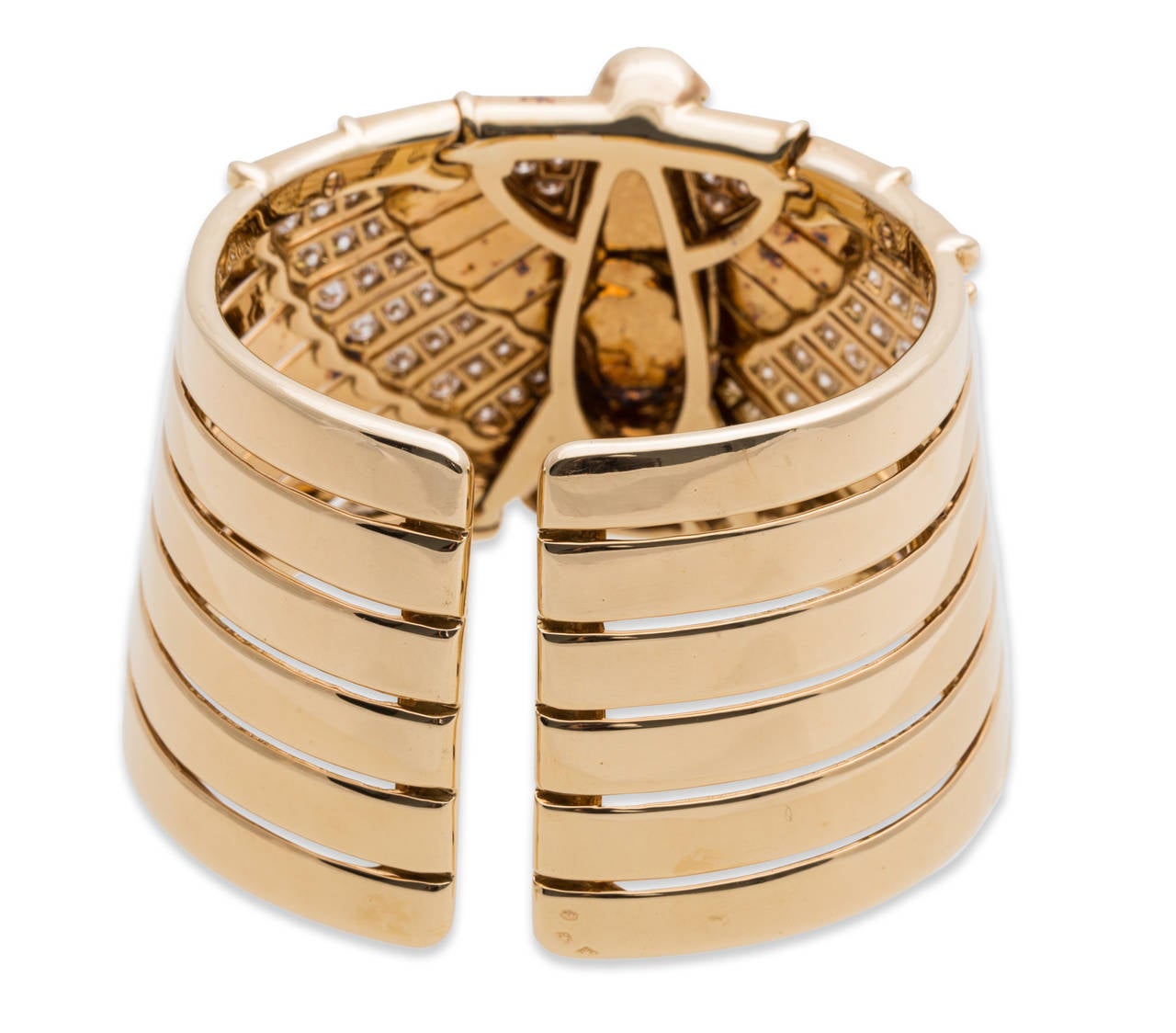 Cartier Egyptian Revival Bracelet in 18K Yellow Gold. Depiction of an Egyptian Eagle with feathers of diamonds. Stamped 
