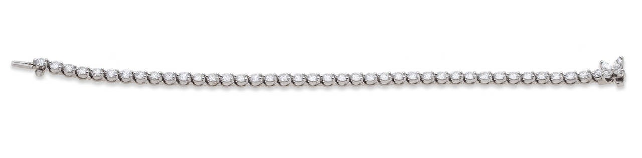 Tiffany & Co. Victoria Bracelet in Platinum. (40) Prong set round diamonds, (4) Prong set marquise diamonds on clasp, Total Diamond Weight 6.54ct, Hallmarked 