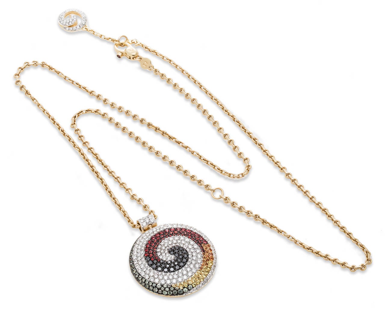 Valente Milano diamond and multi color sapphire, swirl pendant and earring set in 18K yellow gold. Single ruby and diamond charm on clasp. Pendant Length 1.82