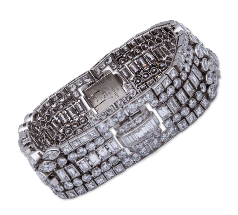 Lacloche Frères Art Deco Diamond Bracelet in Platinum. Created from numerous interconnected bezel set round, marquise, baguette, and French cut diamonds. Length 17.78cm x 2.28cm,  1920's