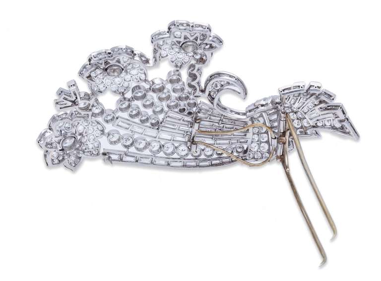 J.E. Caldwell Diamond Floral Bouquet Brooch in Platinum, with Round and Baguette Diamonds. Approximate Diamond Weight: 12.00ct