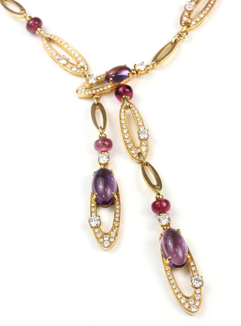 BVLGARI Elisia necklace with Diamonds, Amethyst, and Tourmaline in 18K Yellow Gold. Necklace consists of various size and design yellow gold diamond links, separated by tourmaline rondells. Bottom links with amethyst. Trademark 
