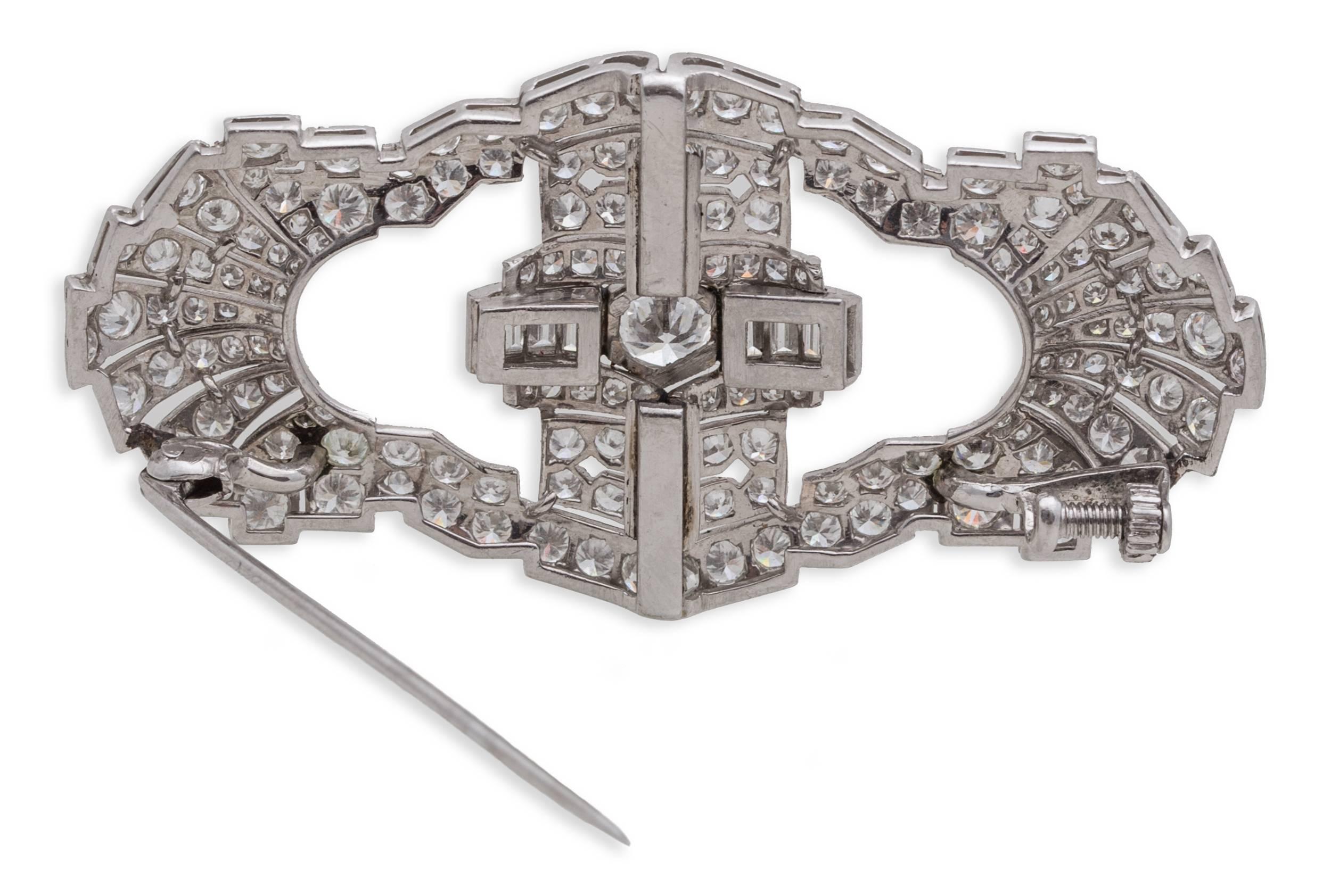 Diamond Art Deco Brooch in Platinum with Round and Baguette Diamonds. Round Center Diamond: 0.90ct., Total Diamond Weight: 9.30ct, Brooch Dimensions: L 2.53