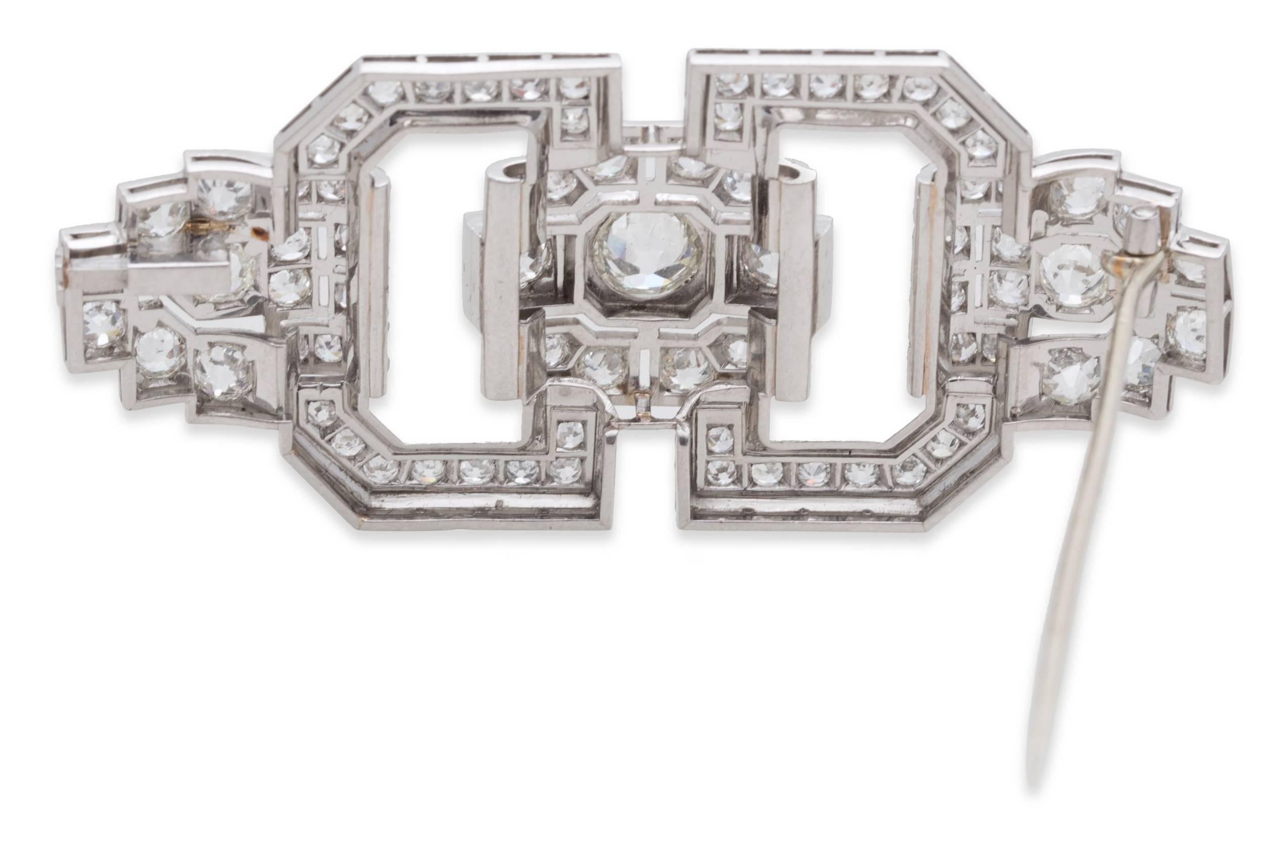 Diamond Art Deco Brooch in Platinum with Round Diamonds. Round Center Diamond: 1.00ct., Total Diamond Weight: 6.30ct, Brooch Dimensions: L 2.49