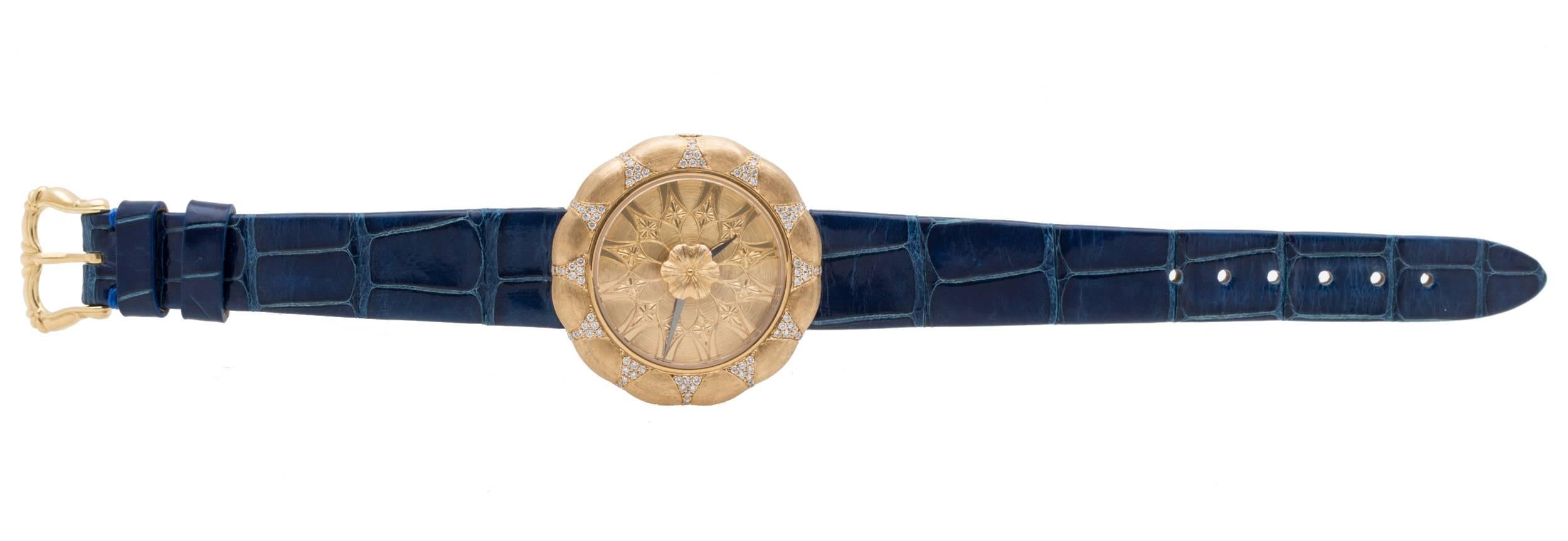 Buccellati Eliochron 35 Ladies Watch in 18K Textured Yellow Gold, Diamond Bezel, Gold Dial, 35mm Case, Quartz Movement, Blue Alligator Strap w/ Gold Buckle, New With Box and Papers, Reference Number: W0801102 QTZ, Retail Price: $22,200