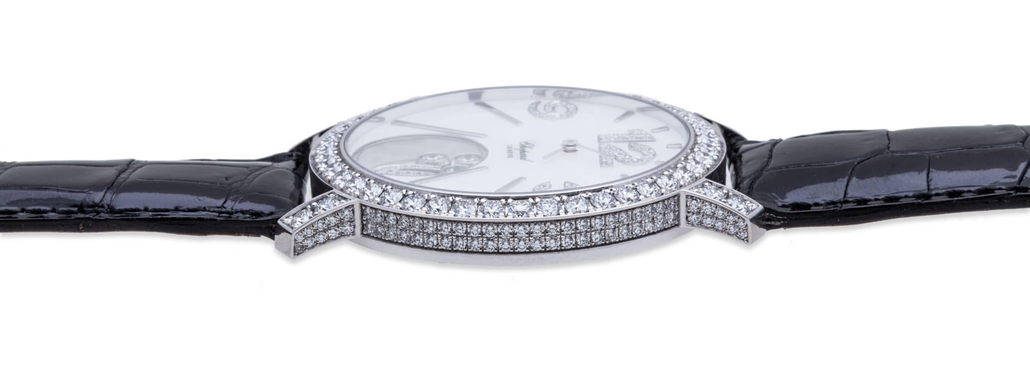 Chopard Happy Diamonds Ladies Quartz Diamond Watch in 18K White Gold, 40mm Full Diamond Case and Bezel, Total Diamond Weight: 3.90ct, White Mother of Pearl Dial with Gold Indexes and Diamond Arabic Numeral Markers at the 9, 12, & 3 o'clock
