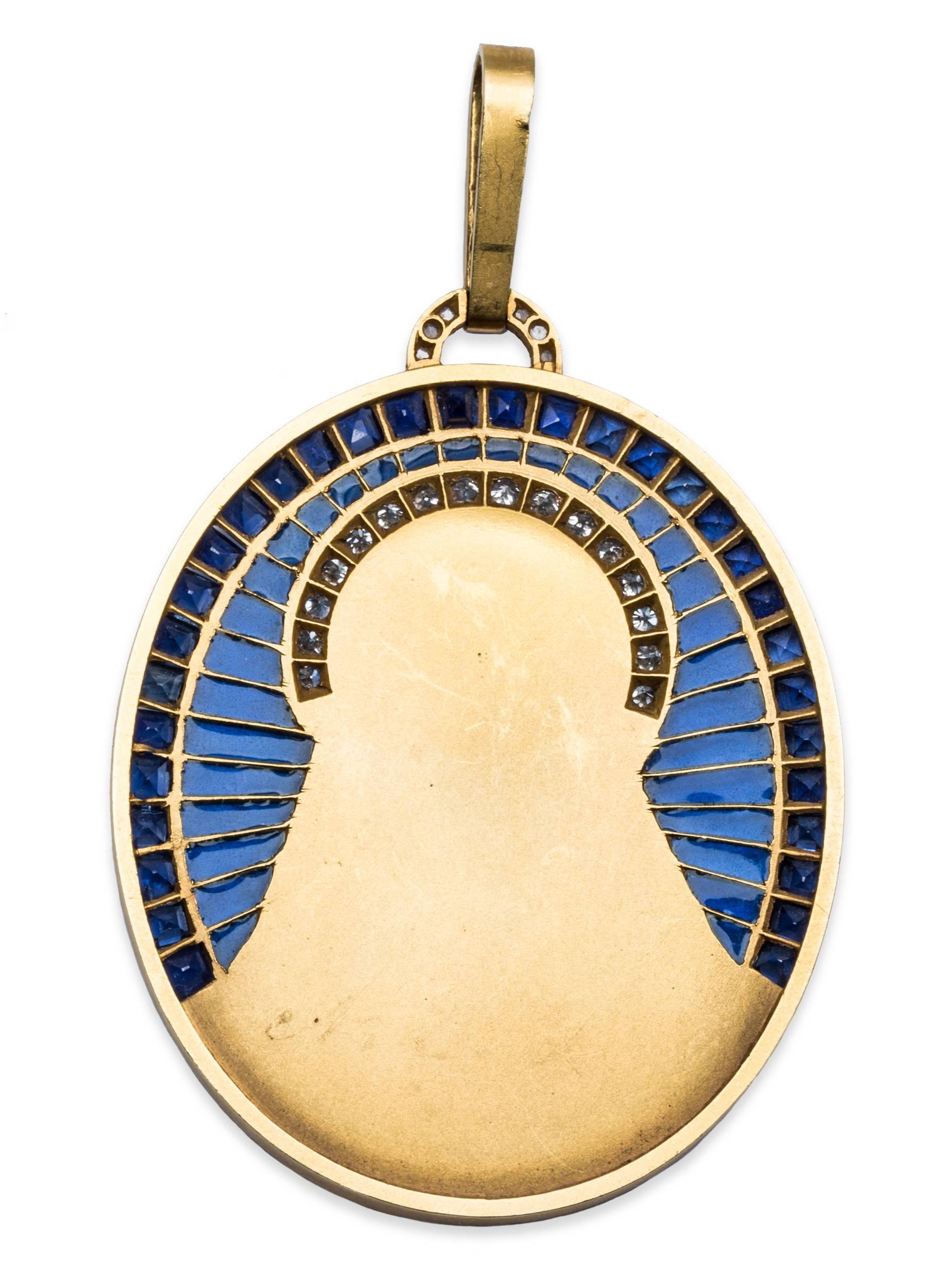Madonna pendant, centering a finely carved depiction of the Madonna at prayer in 18k yellow gold, with a diamond-set halo, surrounded by a semi-circle of plique-à-jour midnight blue vitreous enamel with the edge set with 32 calibre-cut fitted blue