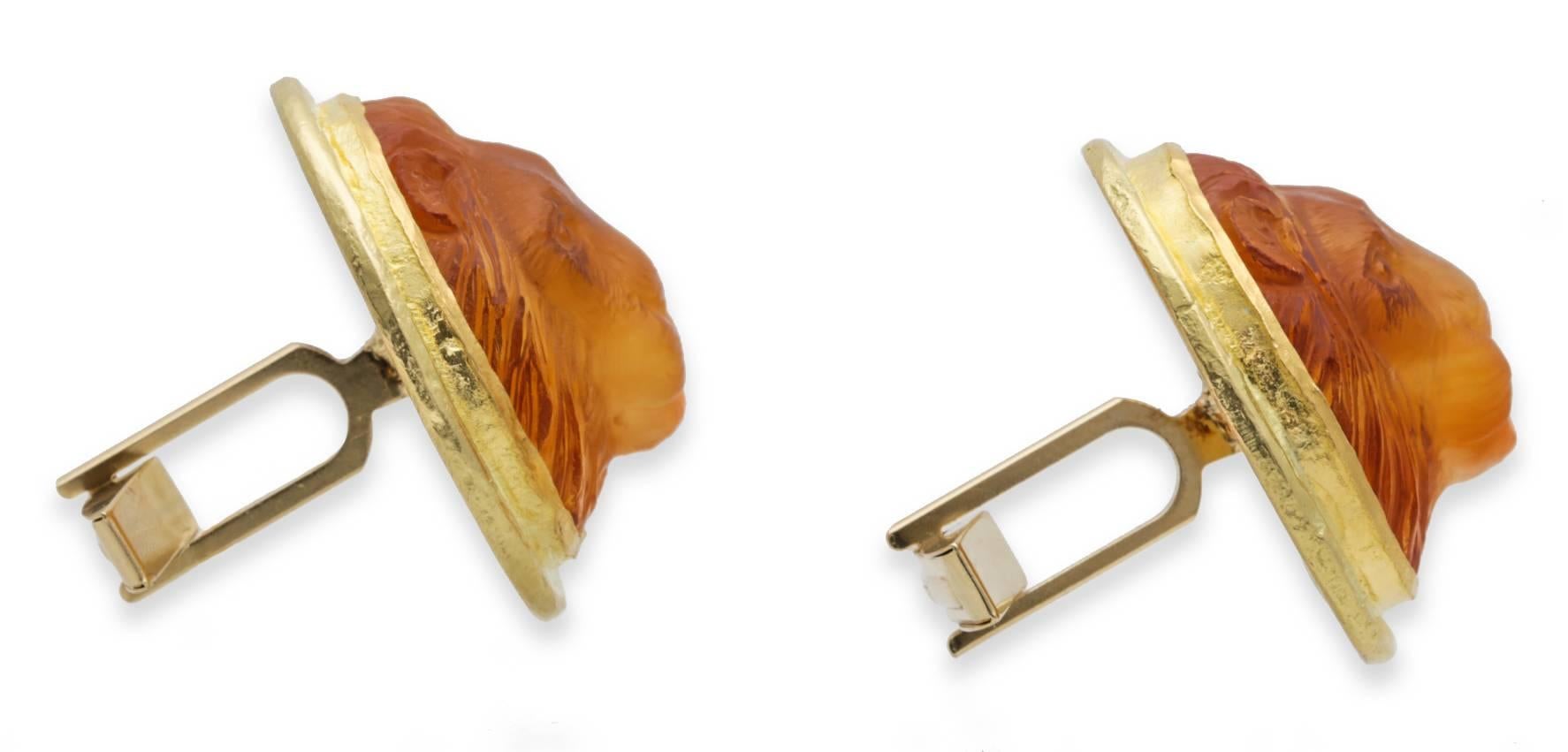 Hand Carved Citrine Lion’s Head Cufflinks set in 18K Yellow Gold. The Citrine is 27 mm by 24 mm.