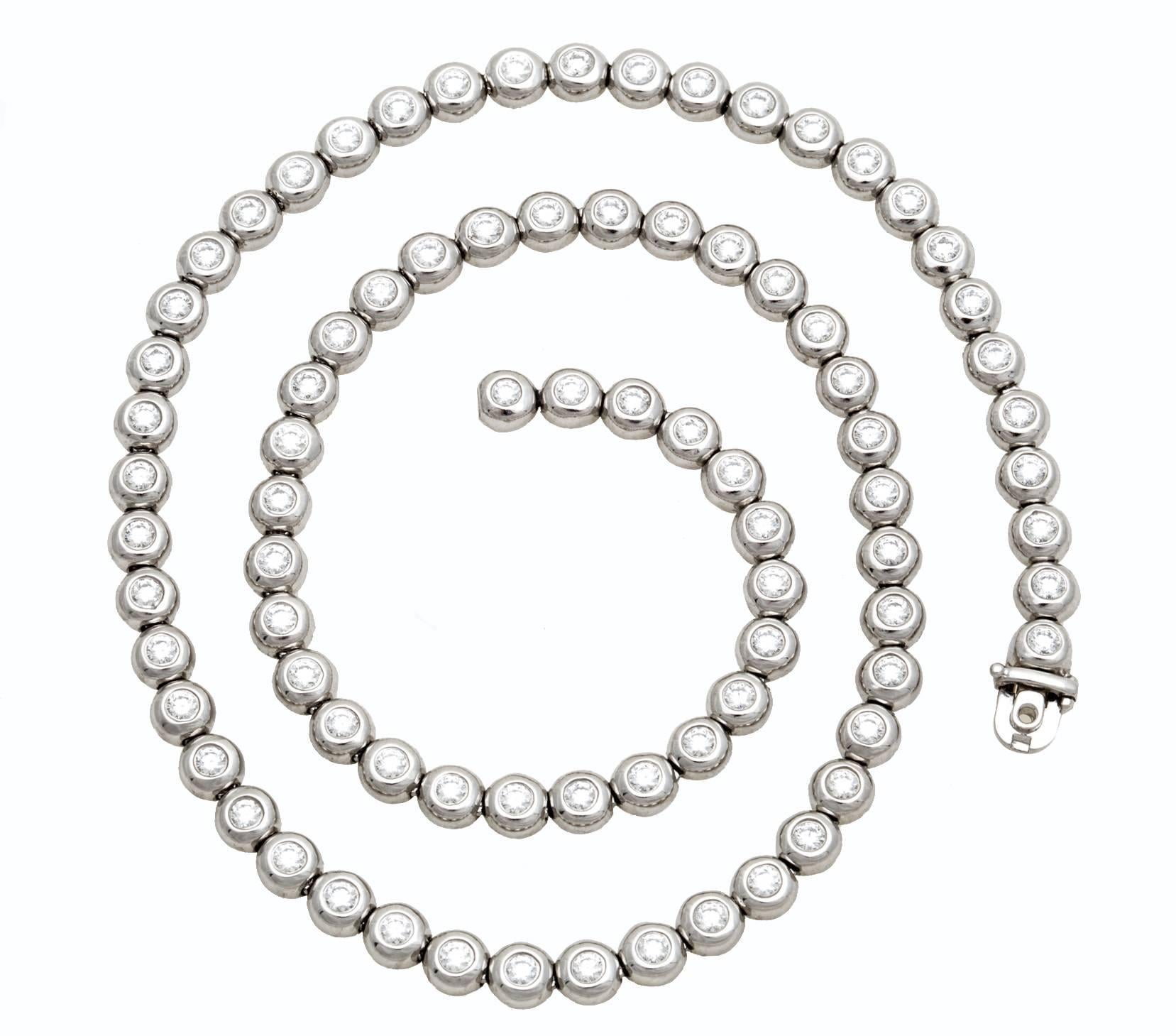 Tiffany & Co. Diamond Tennis Necklace in Platinum. (82) Round Platinum Bezel set diamonds, Total Diamond Weight of 6.50ct., Necklace Length: 16.50