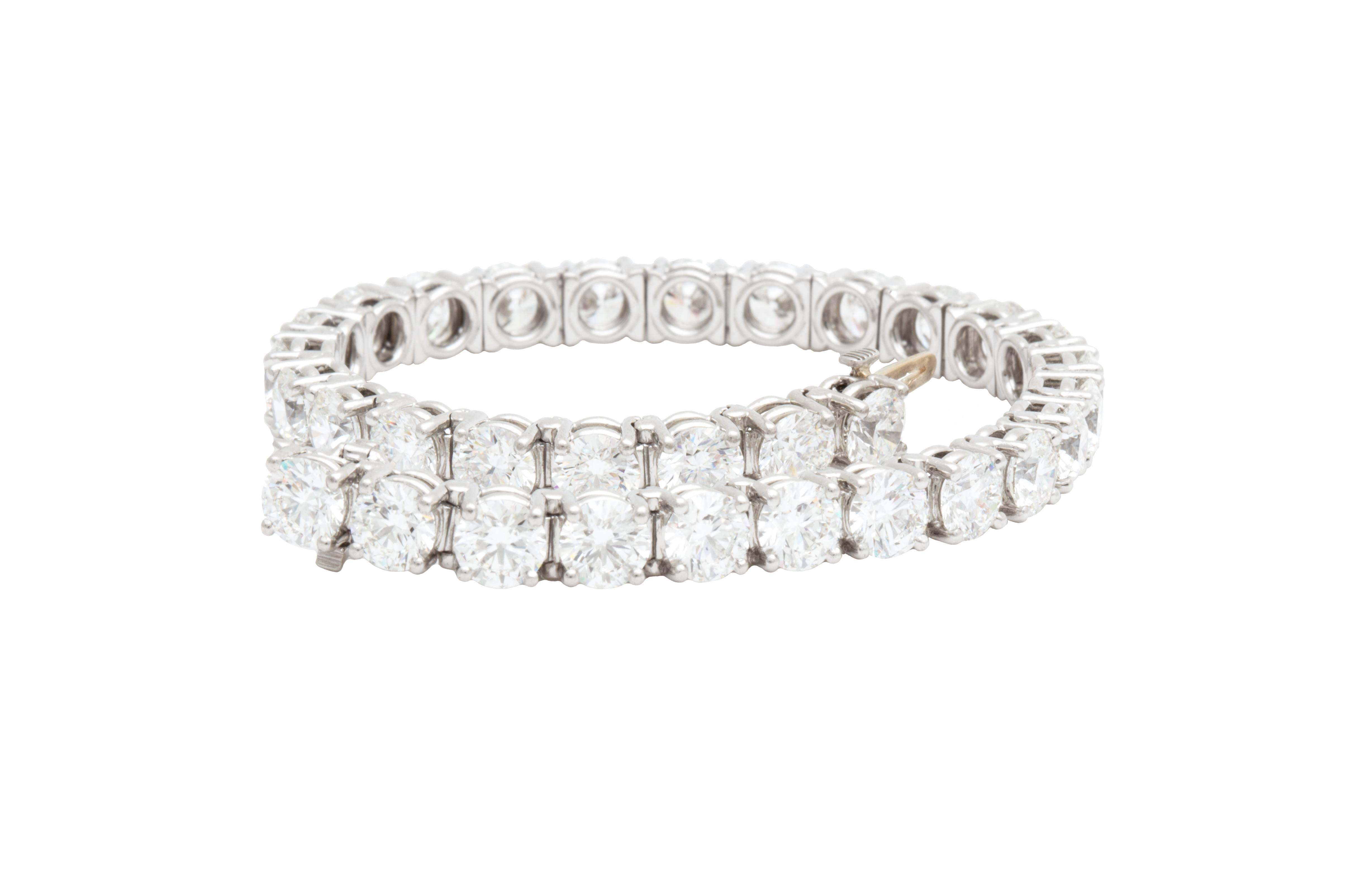 Tiffany & Co. Diamond and Platinum Tennis Bracelet with a total of 32 Round G color/ VVS1 - VVS2 clarity diamonds. Total Diamond Weight: 16.78ct, Total Bracelet Length: 7.125 inches, Each Diamond Inscribed with 
