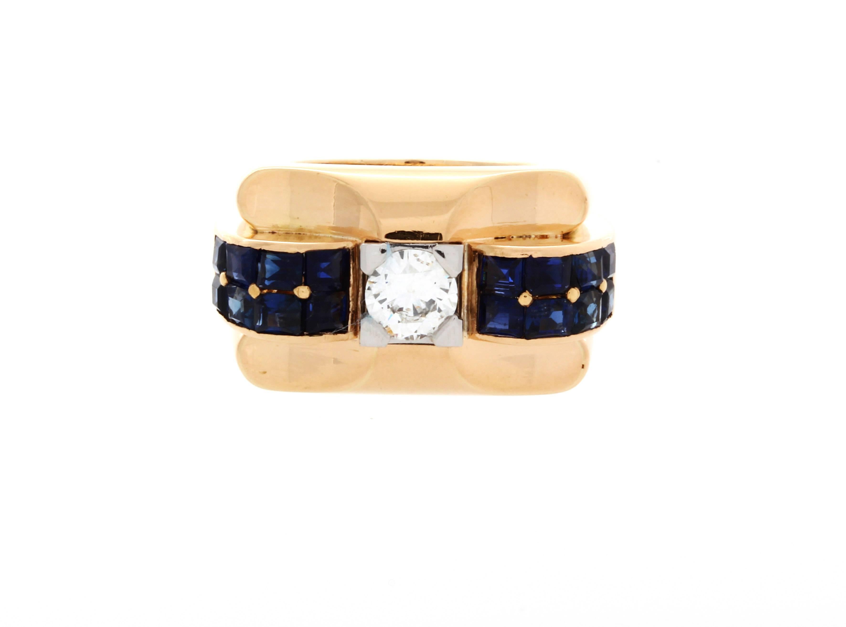 Boucheron diamond and blue sapphire ring in 18K yellow gold. Diamond center stone .75ct, Six blue sapphires on each side of the center stone, Stamped: 