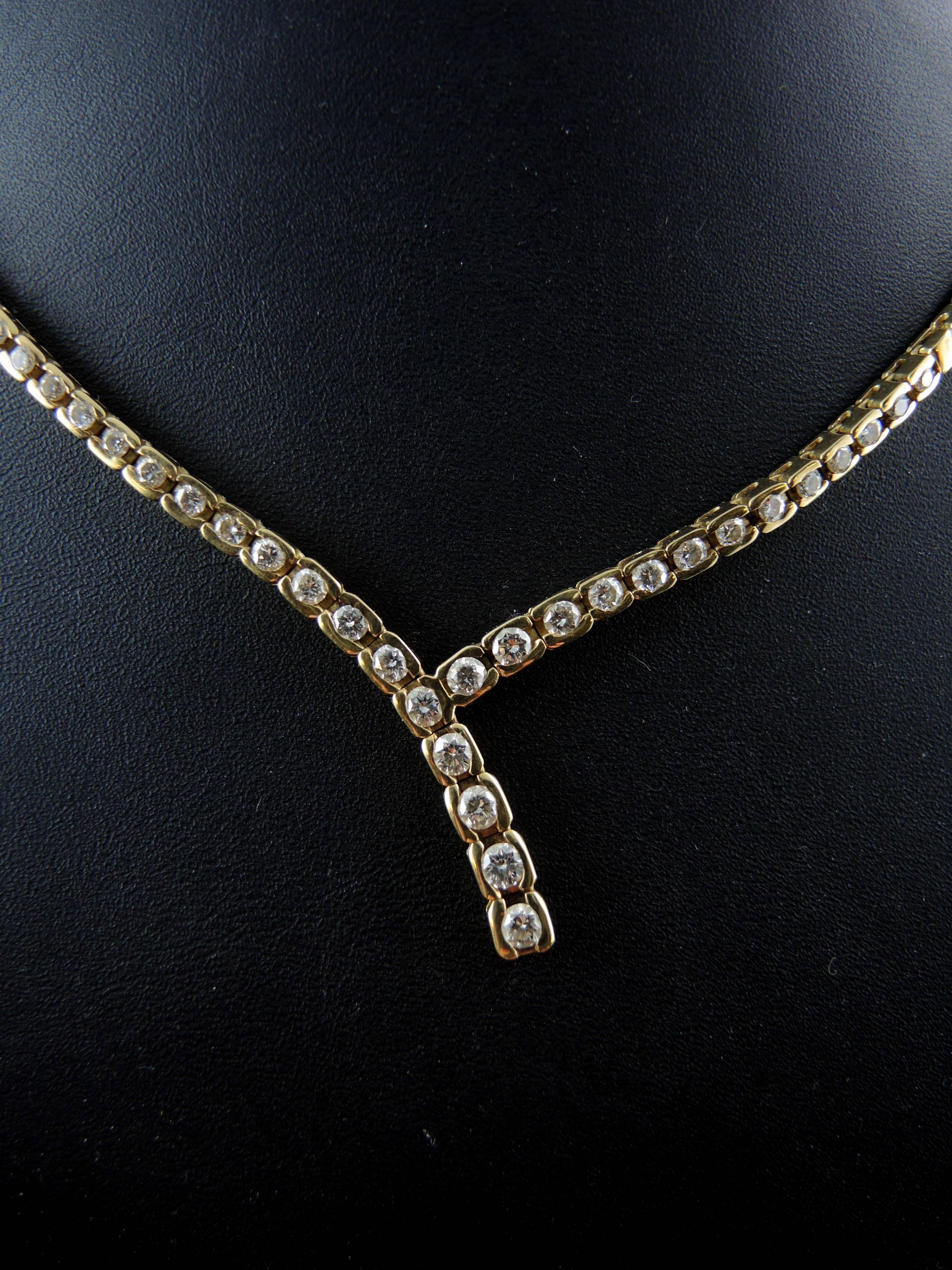 Necklace made of 18kt gold (quality marks: owl).  
This stunning necklace is set with modern cut diamonds, which total weight is apx 2,10 Cts (Etimated color I/ clarity SI).  

Height of the pendant: 2,00 cm 
Length of the necklace: 43,00