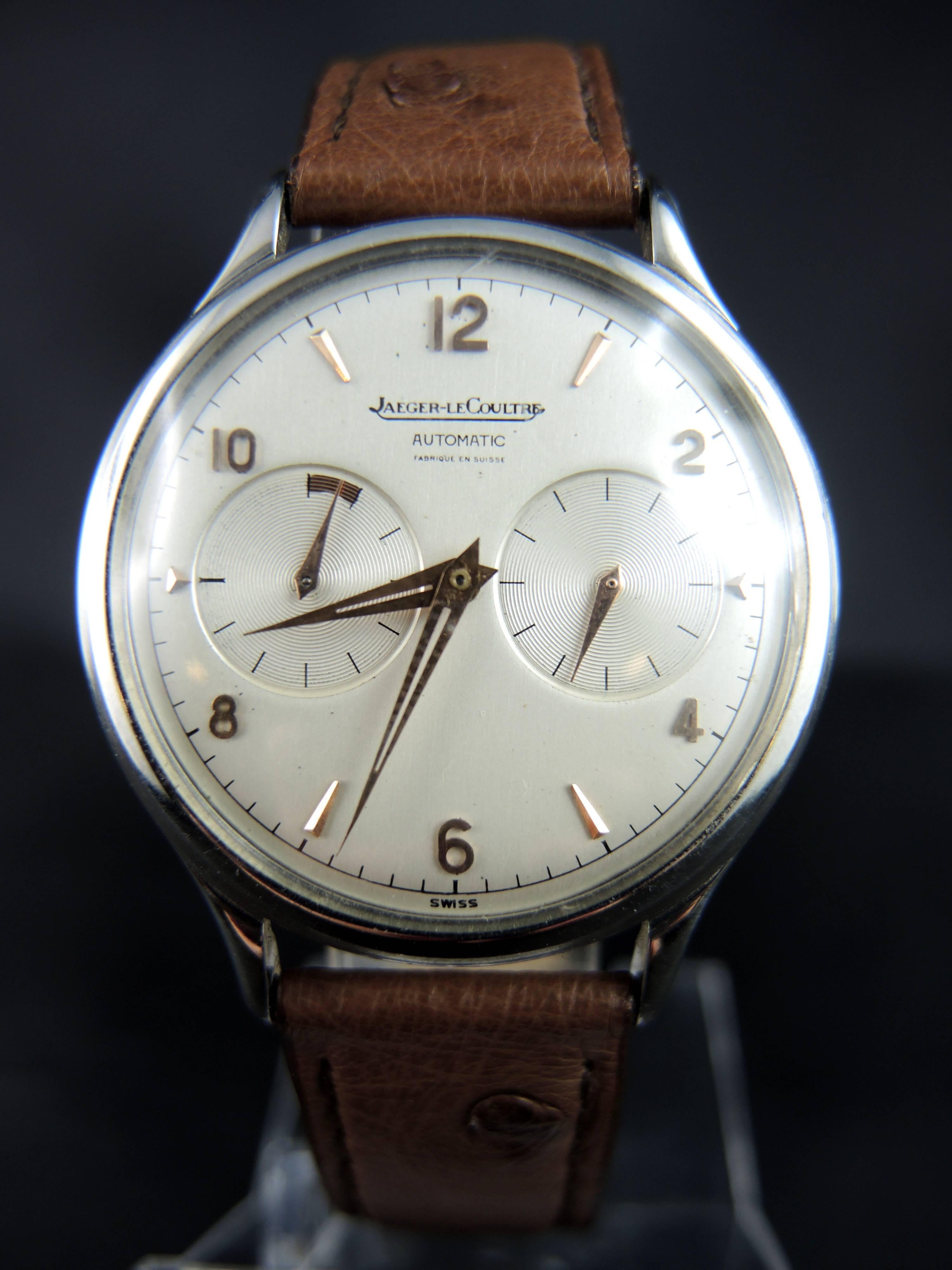 A superb and very rare Jaeger-LeCoultre Futurmatic wrist watch, made in 1957.

Steel box, with silvered dial features applied baton indexes and arabic numerals, constant seconds, and power reserve display.
Crown at the back of the