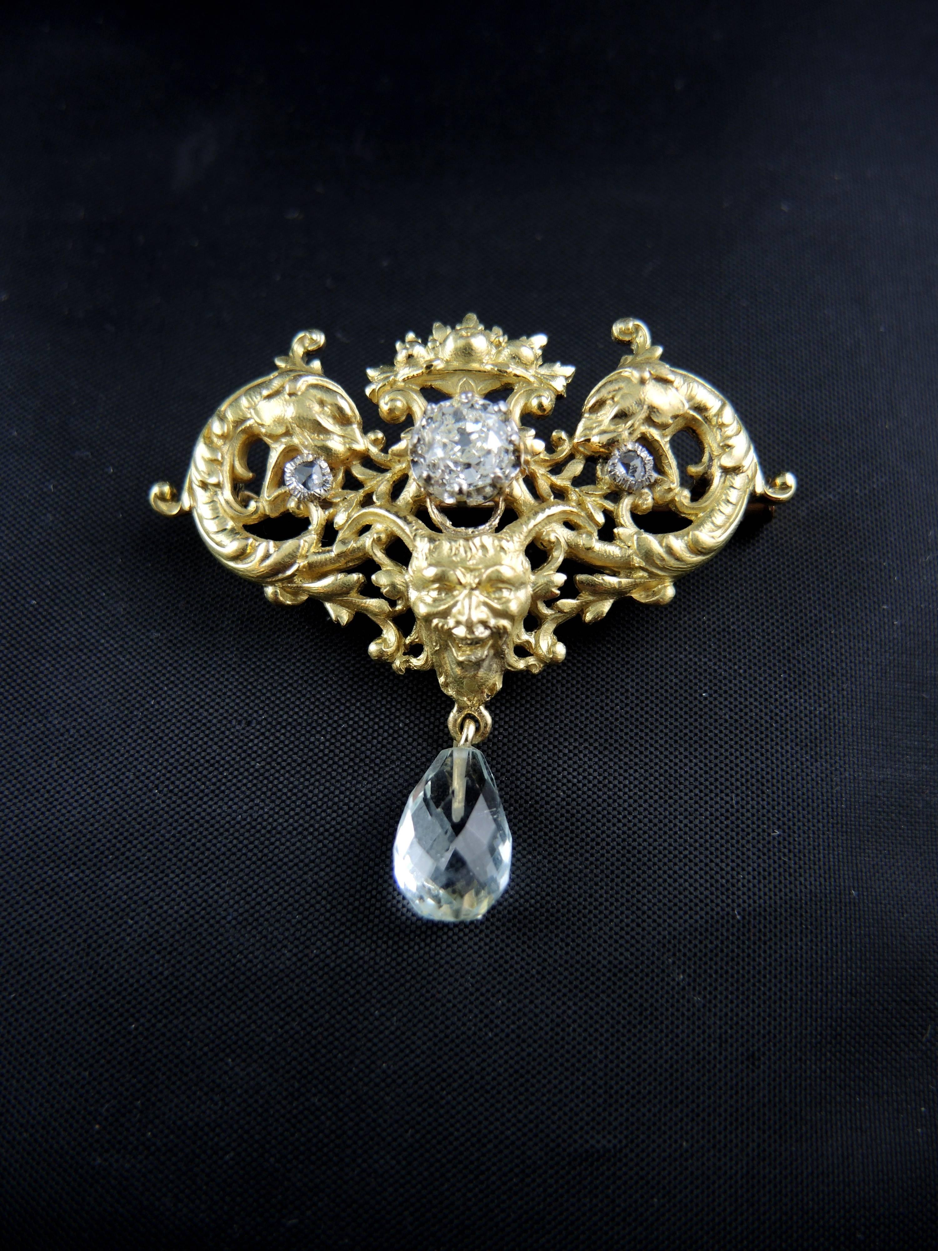 18kt yellow gold and platinium antique brooch / pendant (quality mark: owl and mascaron) set with a stunning central old cut diamond, weight around 0,85 Ct, 2 rose cut diamonds, total weight apx 0,15 Ct, and a pear cut aquamarine, weighting apx 2,50