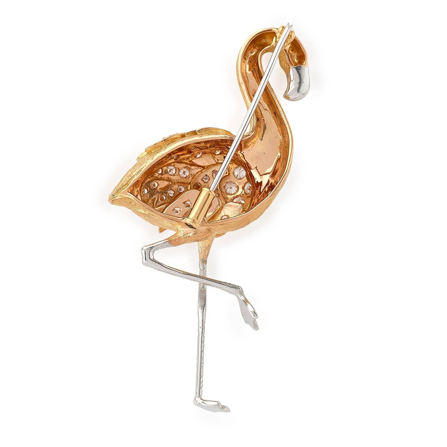 Flamingo brooch with 18 carat rose gold body and .74 carats diamonds set to wings, 18 carat white gold beak and legs, cabochon ruby eye and textured body. With easy to use yet secure tube catch brooch fitting. Handmade in E Wolfe and Company’s