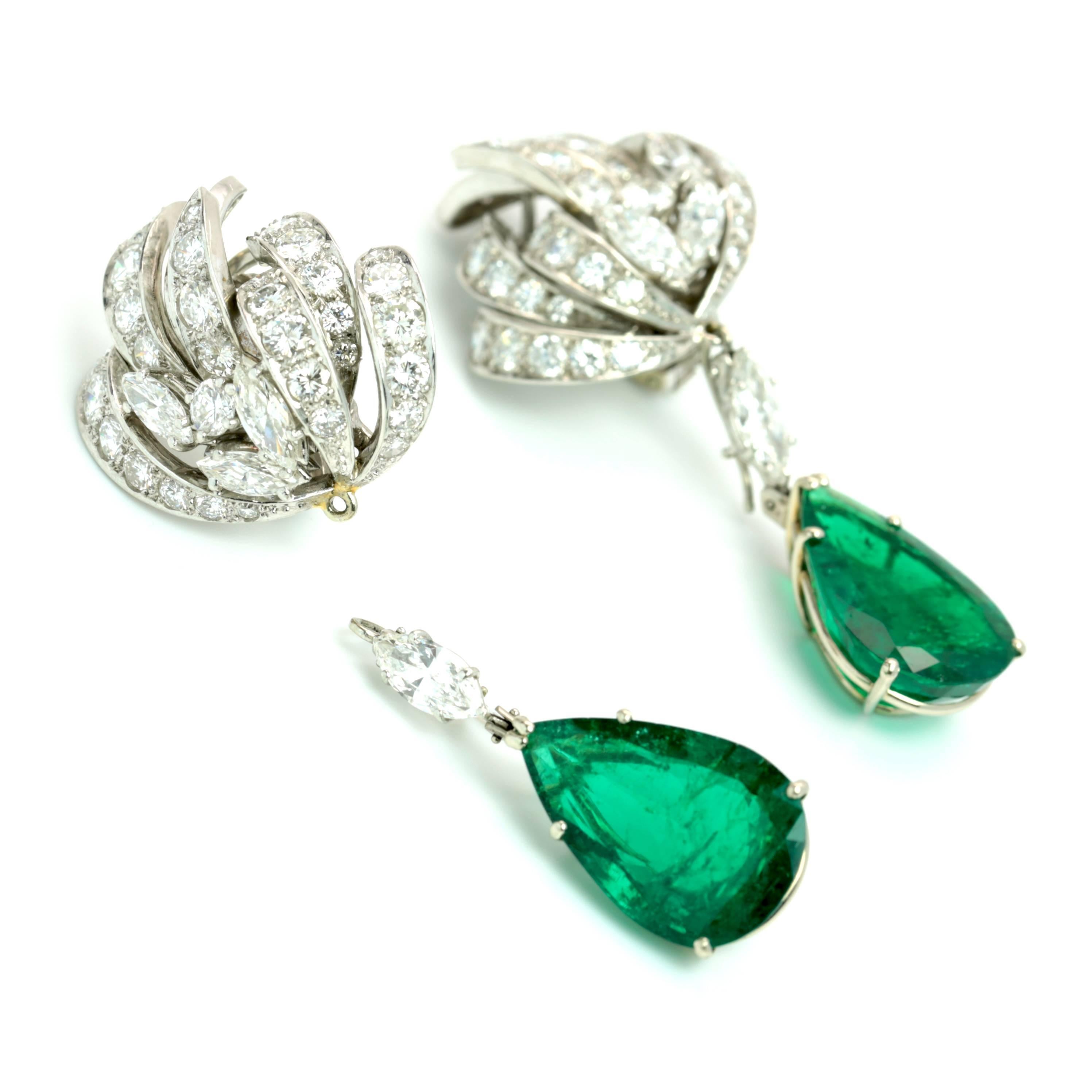 These Magnificent Emerald and Diamond Earrings are set with 2 Pear Shape Emeralds, 9.45 + 9.28 equaling 18.73 that are SSEF Certified (SWISS GEMMOLOGICAL INSTITUTE) Certificate # 77265  Ct. Colombian Emerald Natural Beryl. Platinum Mounting set with