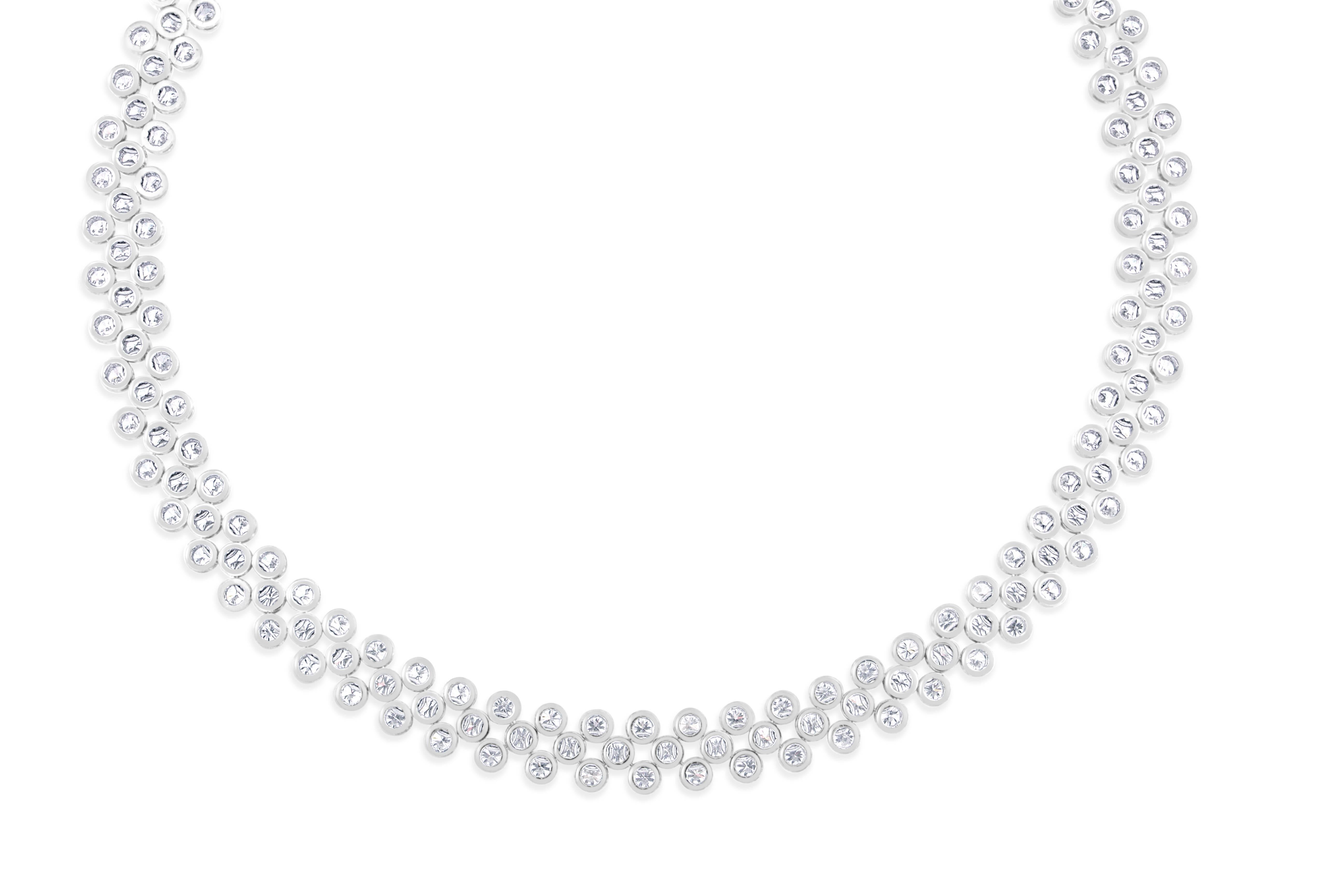 This divine diamond necklace features 293- round brilliant cut diamonds weighing 19.95 carats total, having VS clarity and G color. This necklace has the marvelous feature of being worn at two different lengths. It’s full length at 19 inches, or at