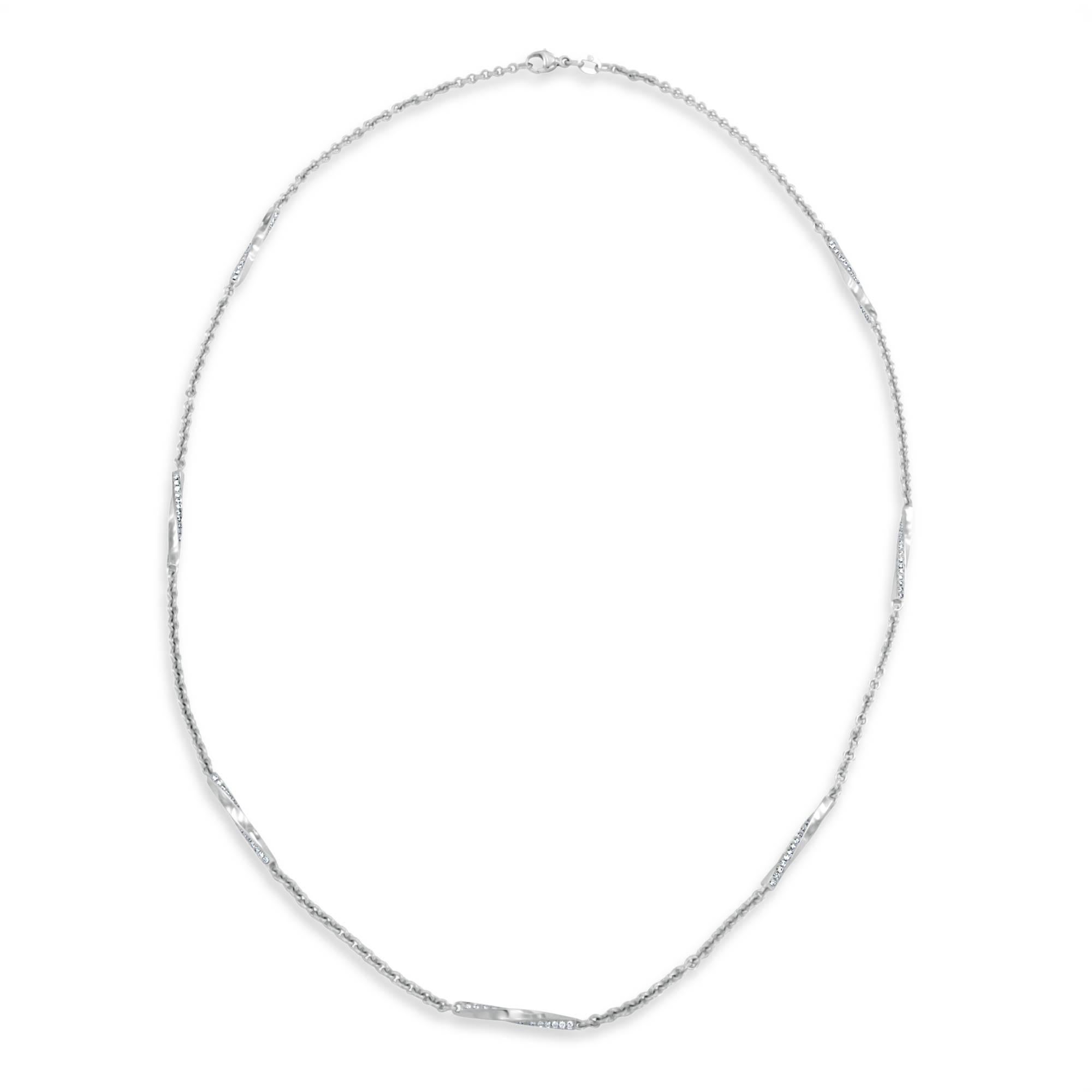 This posh 18 karat white gold chain necklace features seven spiral links containing 30-round brilliant cut diamonds each that are sublimely placed between one and a half inches of 2.30mm wide cable chain. The 210-diamonds weigh 1.05 carats total,