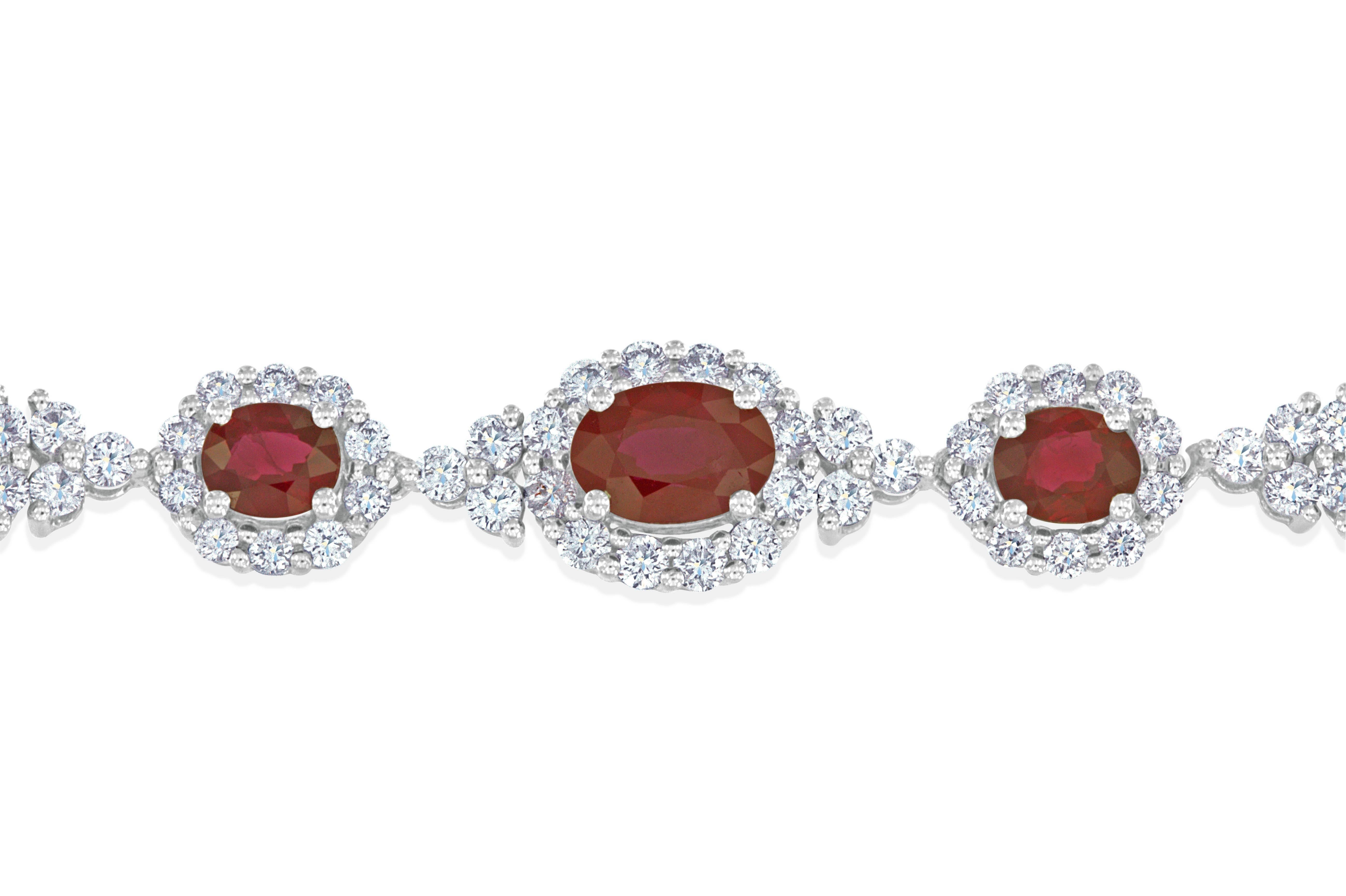 This elegant Burmese ruby and diamond bracelet features 14- oval cut Burmese rubies weighing 11.14 carats total, having excellent color and cut. Set with 224- round brilliant cut diamonds weighing 4.72 carats total, having VS clarity and G color.