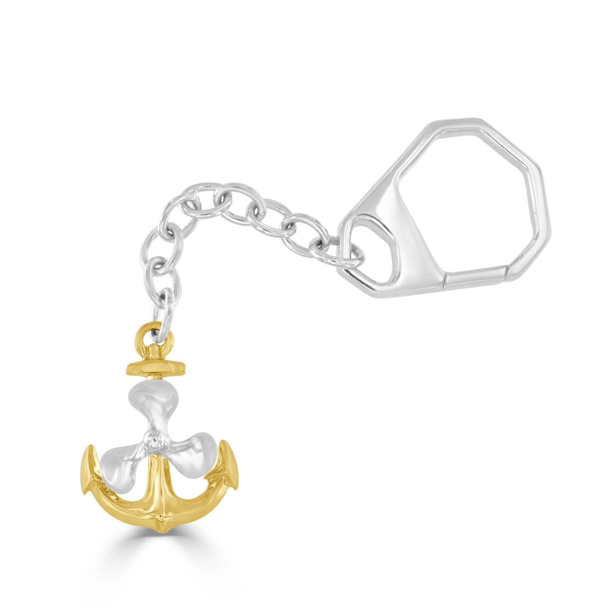 This nautical themed 14 karat white and yellow gold key chain features a white gold propeller that spins! The yellow gold anchor measures 1.0 inch in length and 0.75 inch in width. Entirety of the keychain measures 3.75 inches in length and weighs