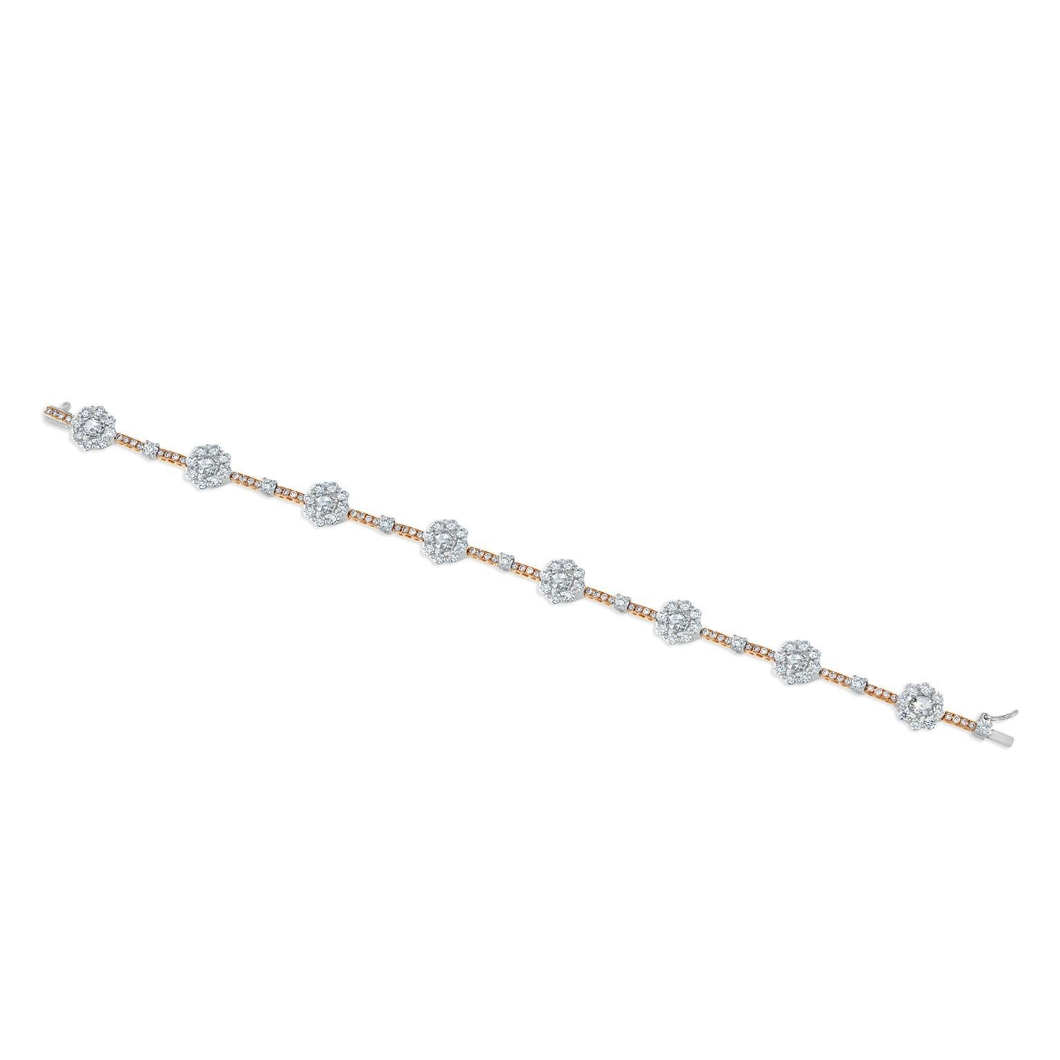 This superb diamond bracelet features 8- rose cut diamonds, 64- round brilliant cut natural fancy pink diamonds and 72- round brilliant cut diamonds weighing 4.00 carats total. Set in 18 karat white and rose gold, measuring 6.5 inches in length.
