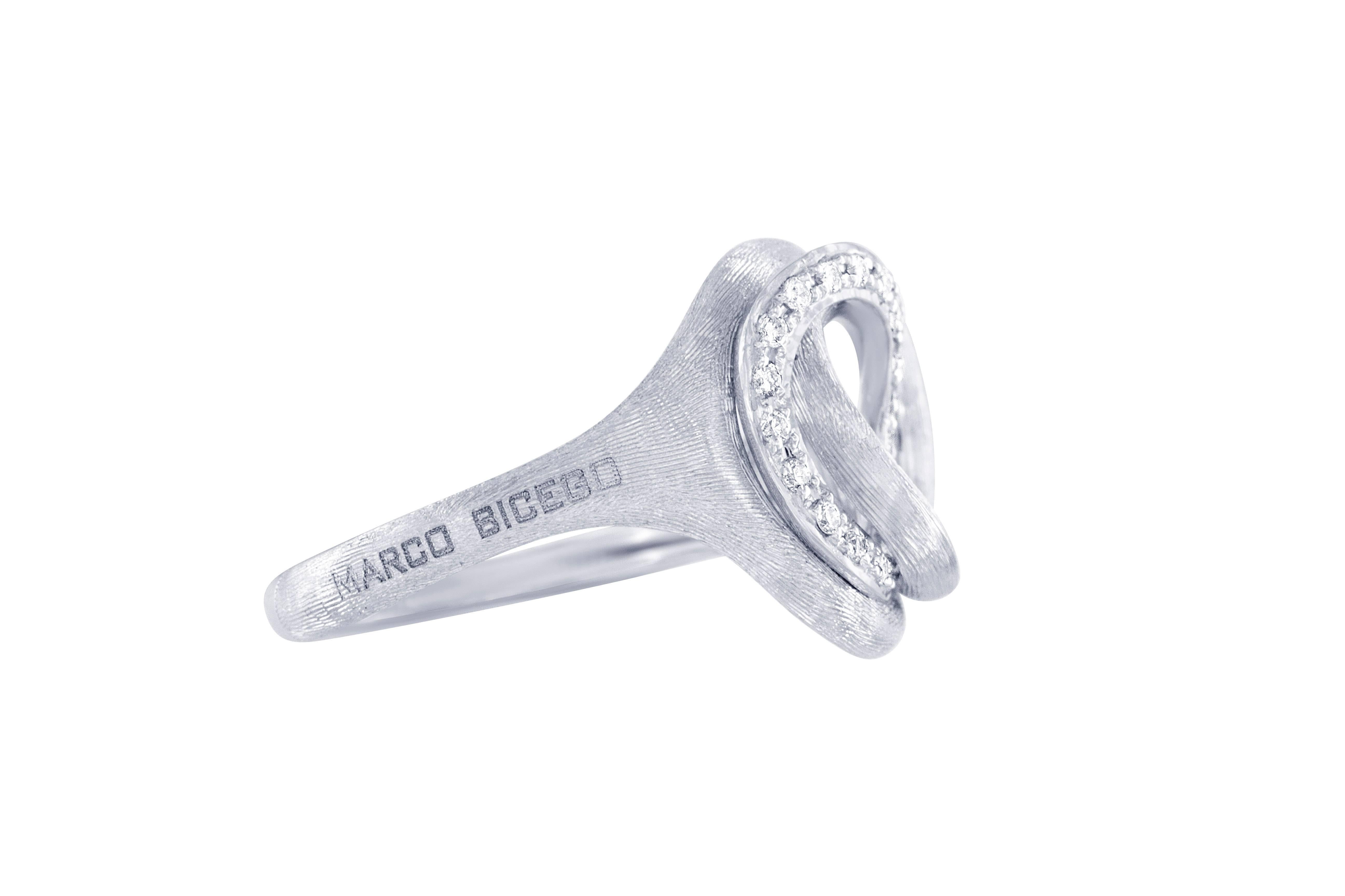 This subtly intricate Marco Bicego designer ring from the Jaipur collection consists of an 18 karat white gold hand engraved ring mounting, with 21- round brilliant cut diamonds weighing 0.14 carats total, having VS clarity and G color. Current size