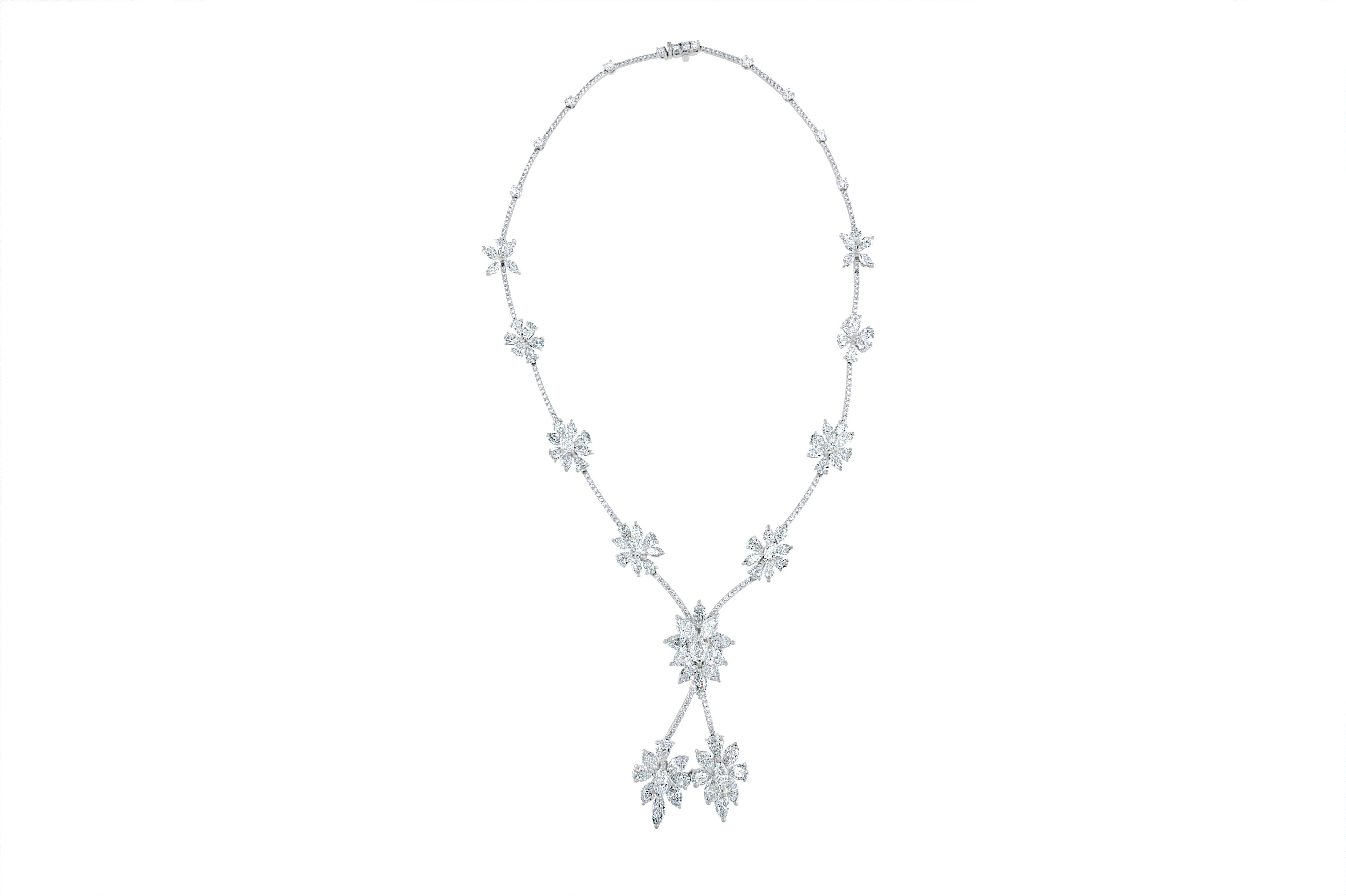 This exquisite diamond necklace was recently handcrafted in the celebratory honor of Ahee Jewelers 70th anniversary. This one-of-kind platinum necklace is adorned with 34- pear shape diamonds weighing approximately 12.62 carats total, 53-marquise