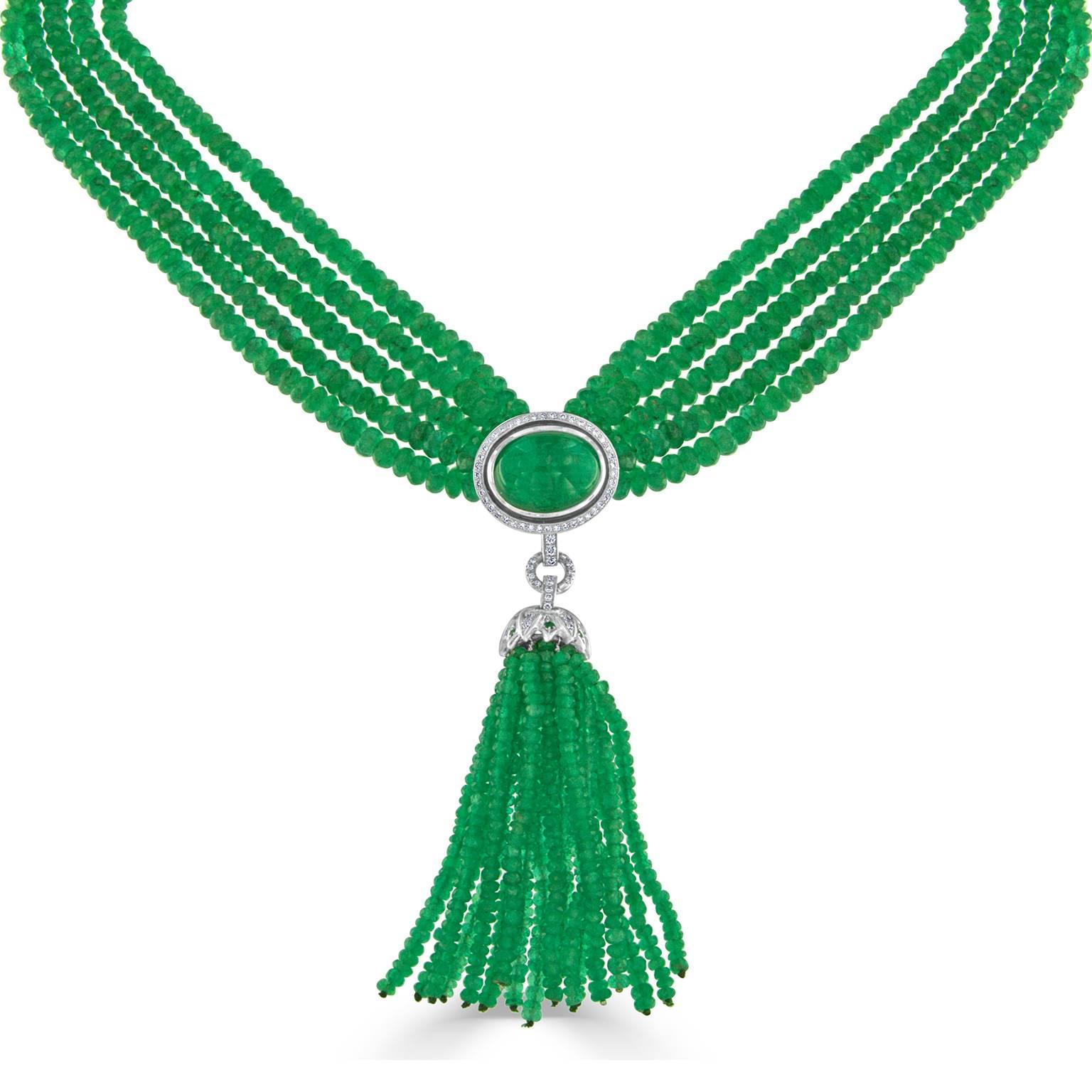 This enchanting five strand emerald and diamond 18 karat white gold necklace features 1,327 emeralds weighing 408.31 carats total. Necklace also adorned with 112 round brilliant cut diamonds weighing 1.01 carats total. Measuring 16 inches in length,