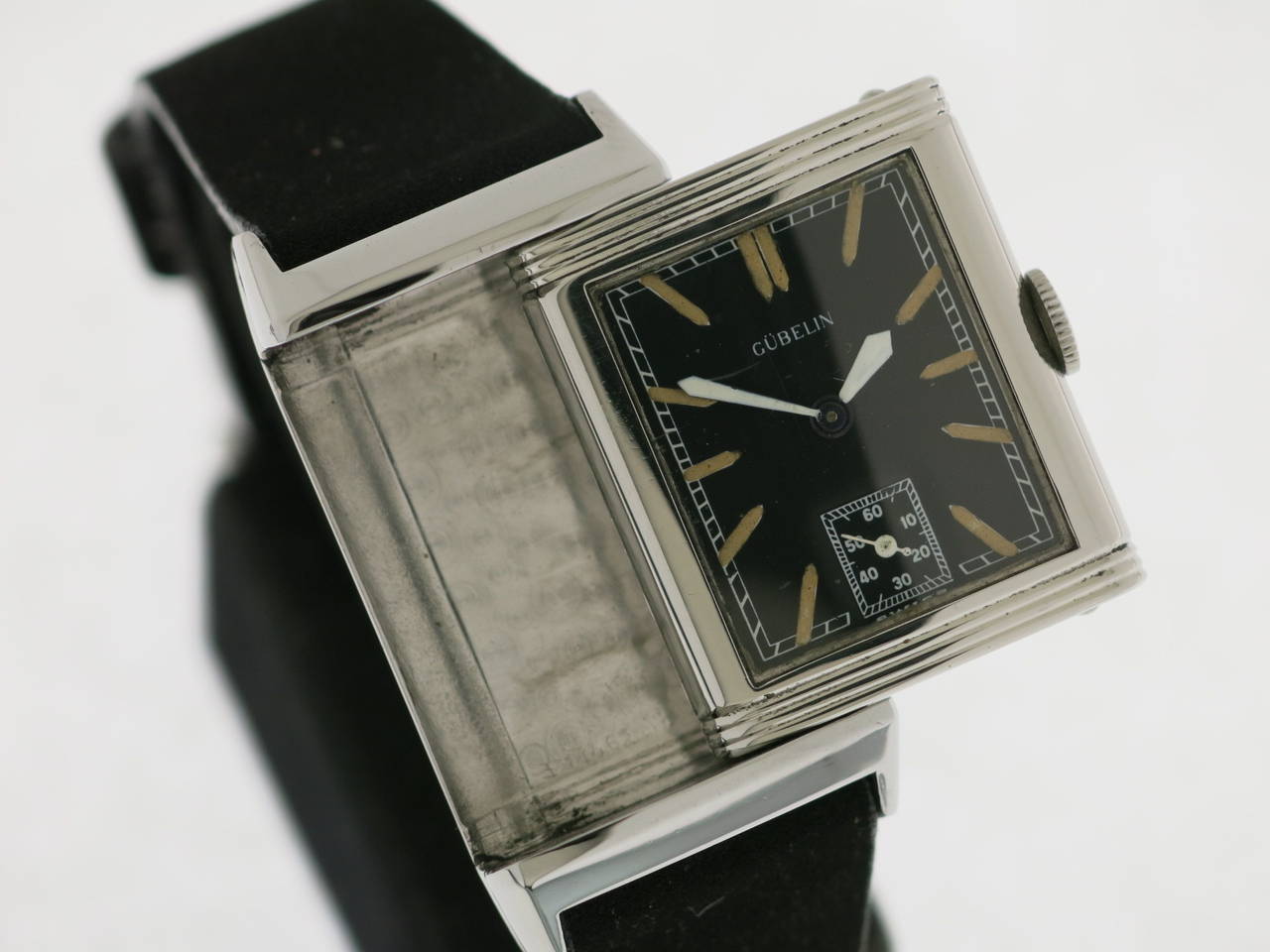 An amazing stainless steel Jaeger-LeCoultre wristwatch, with a beautiful black dial, retailed by Gubelin.