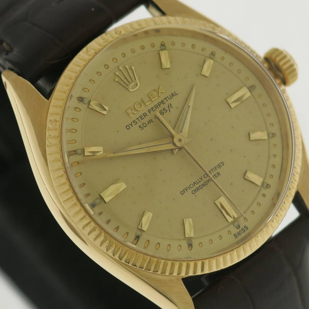 Unusual and very rare 18 KT.yellow gold Rolex oyster,water resistant case with special honeycomb dial and registered meters and feet. Doré color dial with applied gold indexes and dauphine hands. Sweep centre seconds.