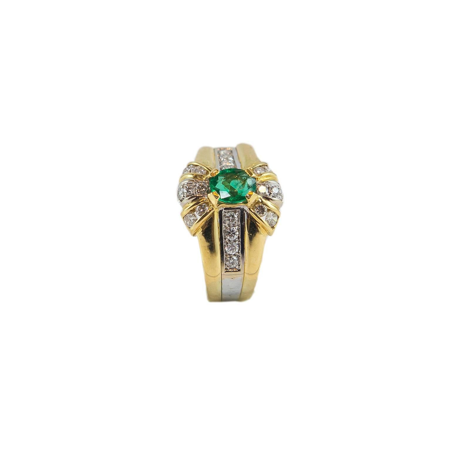 18KT yellow gold ring with emeralds and diamonds. It mounts an emerald of carats 0,49 and diamonds for carats 0,50 diamonds 