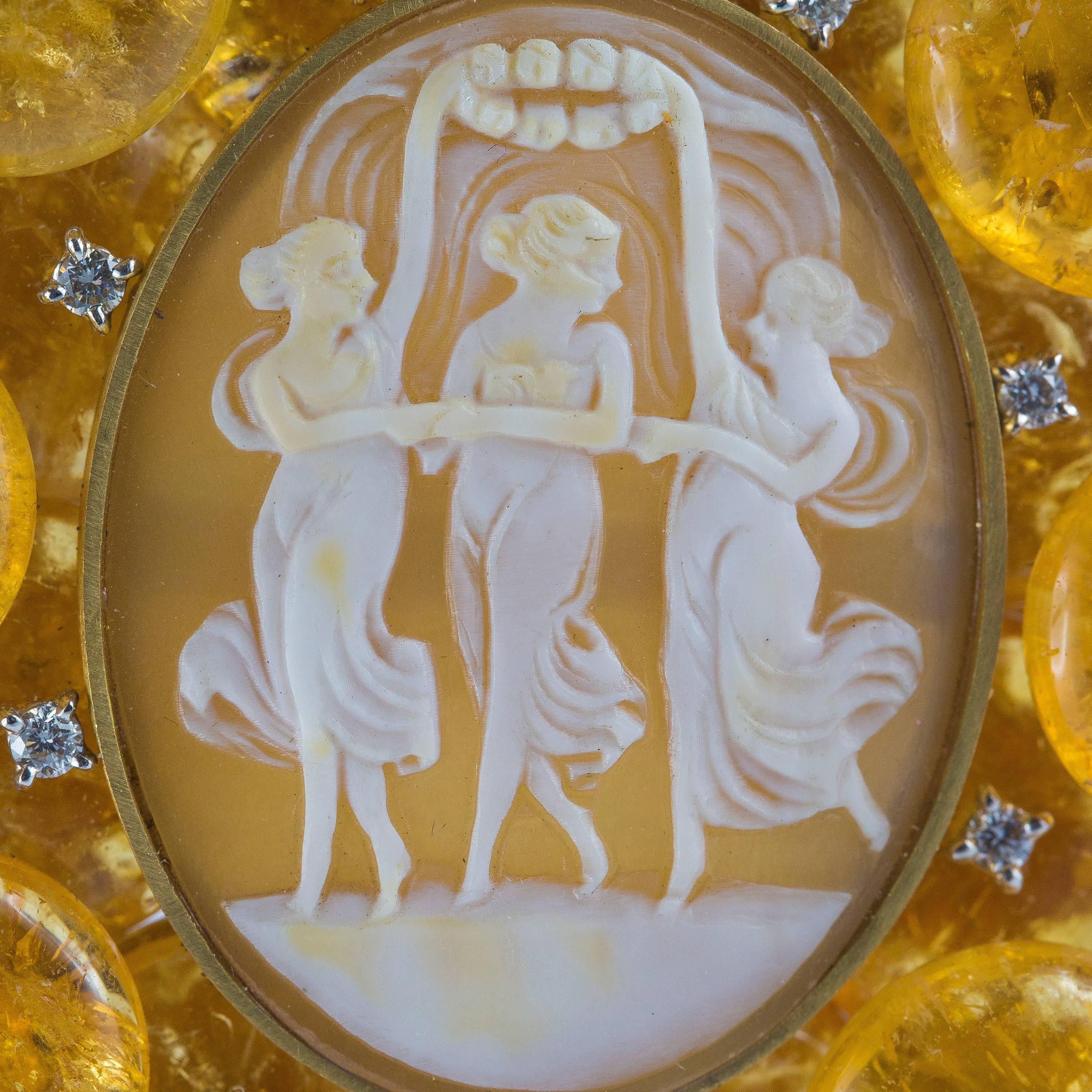 18 Karat yellow gold pendant with a beautiful cameo on conch shell depicting three graces and a circle motif citrine quartz outline with 0,45 ct. of brilliant cut diamond details.