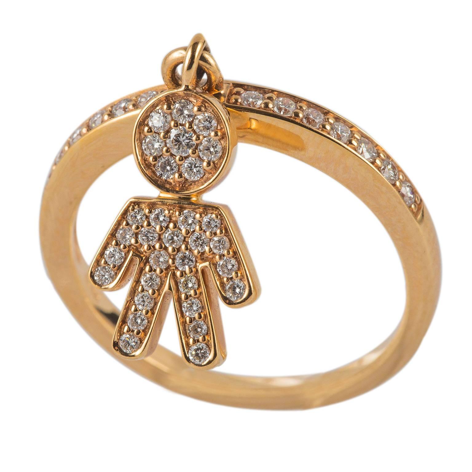 18 Karat yellow gold ring with 0,34 ct. of brilliant cut white diamonds on the top of the ring and forming an adorable baby boy. 
Size 6 ¾ US – 54 EU