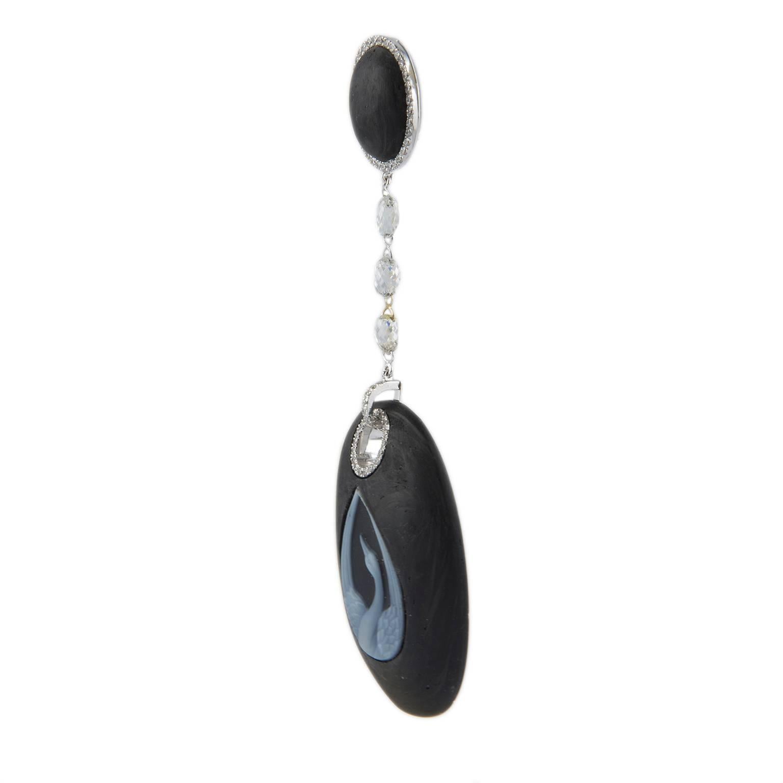 Very special carbon earrings with an agate cameo representing a wonderful swan, supported by briolette cut diamonds. To embellish the details brilliant cut white diamonds, all mounted on 18KT white gold. Briolette cut
Diamonds  for a total 2.05 ct.
