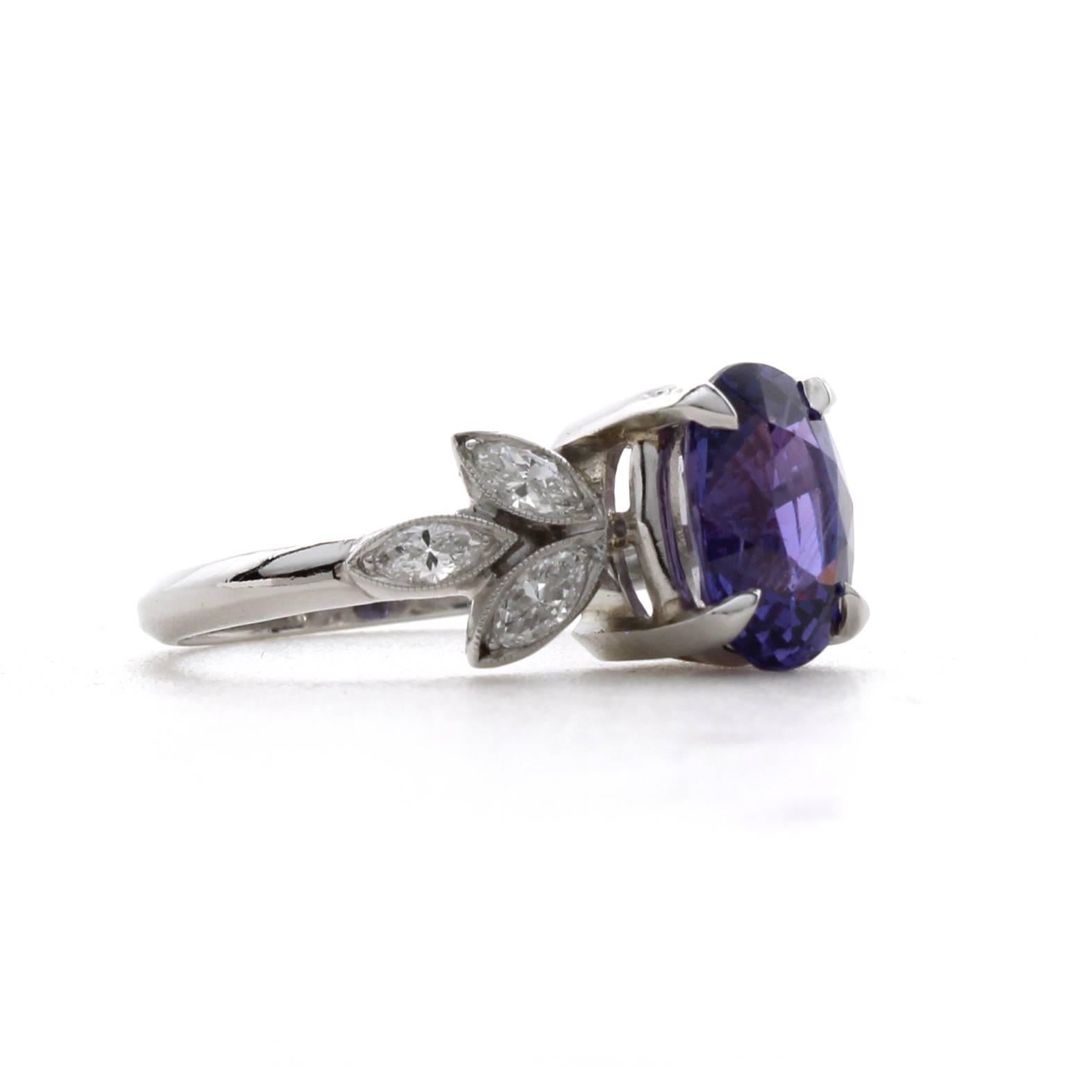 This one-of-a-kind platinum ring features a natural 2.18 carat purple sapphire with no indications of heat treatment. It is accented by six marquise diamonds with a total carat weight of 0.46 and color grade of F-G and clarity of VS1-VS2. 

The ring