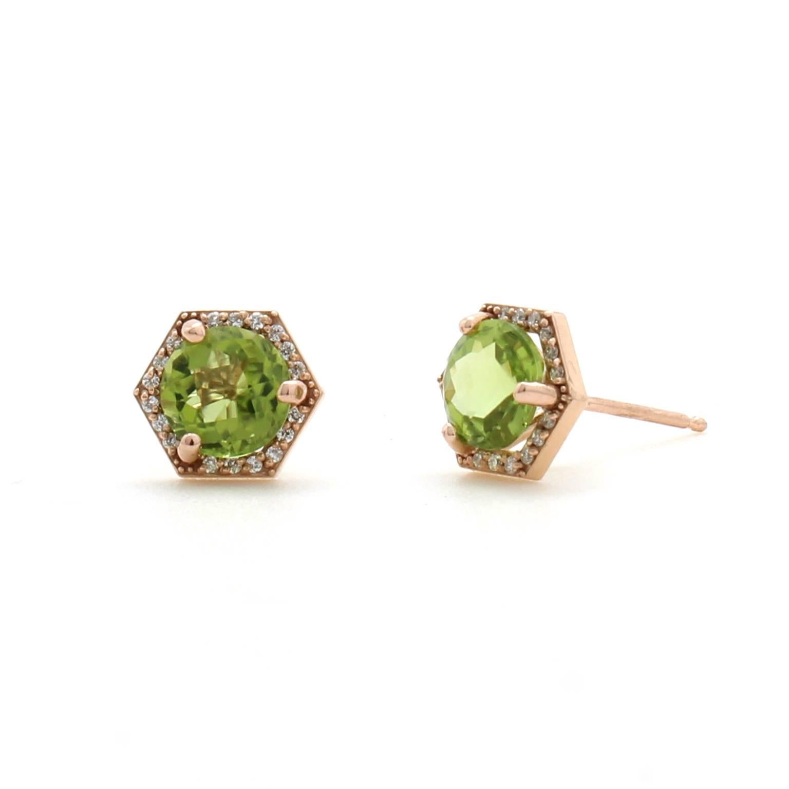 These geometric stud earrings feature natural round peridot gemstones surrounded by a halo of pave set white diamonds. The earrings are made of reclaimed 14k rose gold and have friction posts and backs.

The peridots measure 6mm in diameter. The