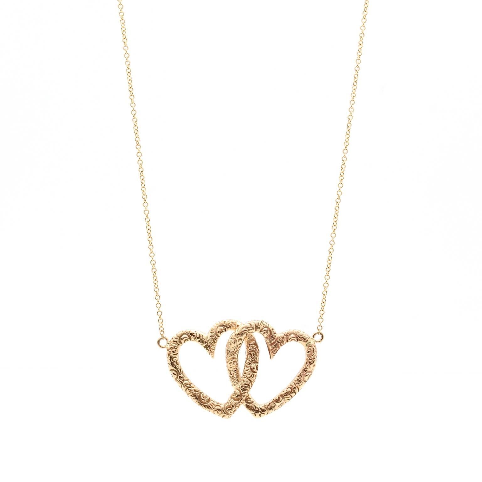 14 Karat Yellow Gold Double Heart Necklace For Sale