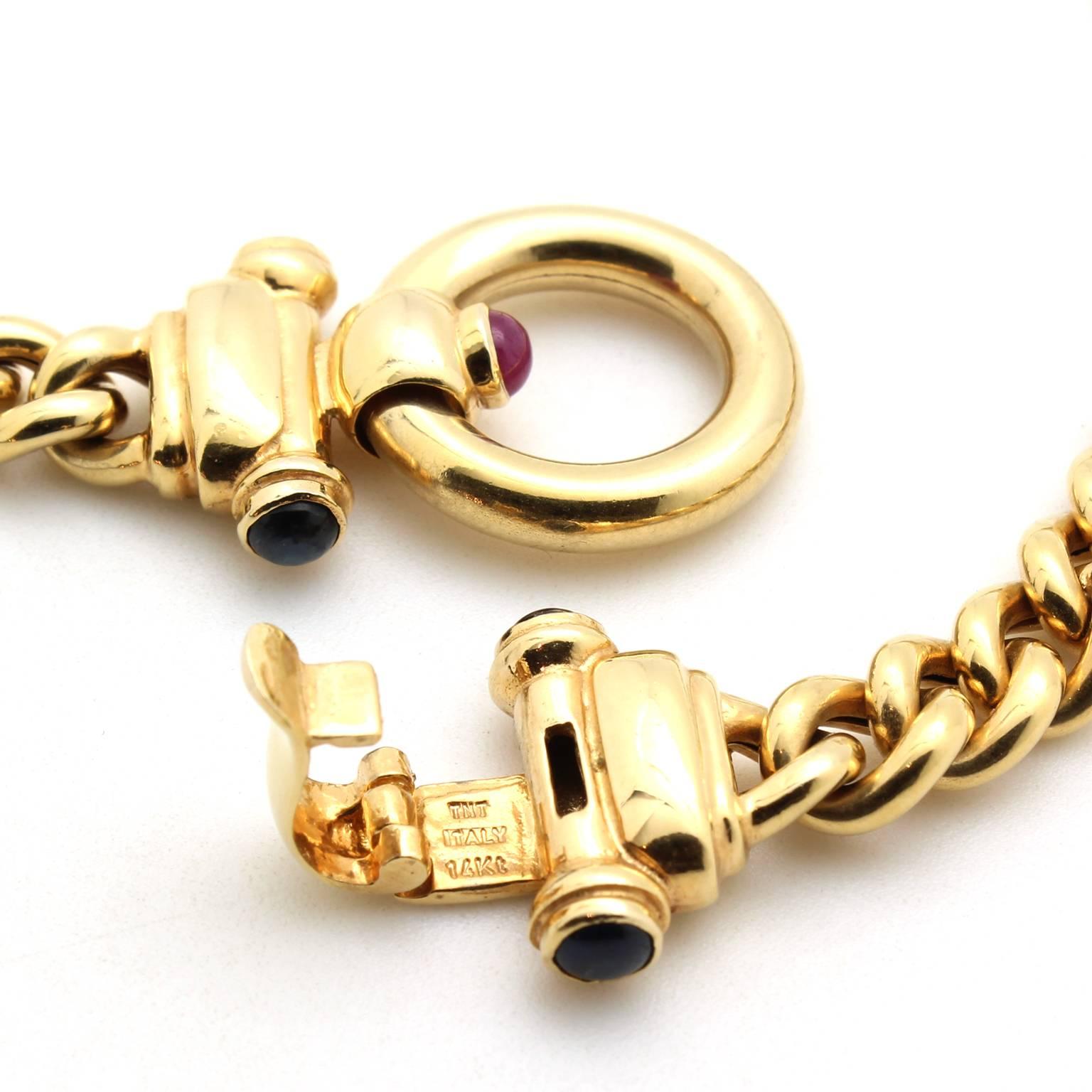 Vintage 14 Karat Yellow Gold Curb Link Chain with Sapphire and Ruby Clasp In Excellent Condition For Sale In San Francisco, CA