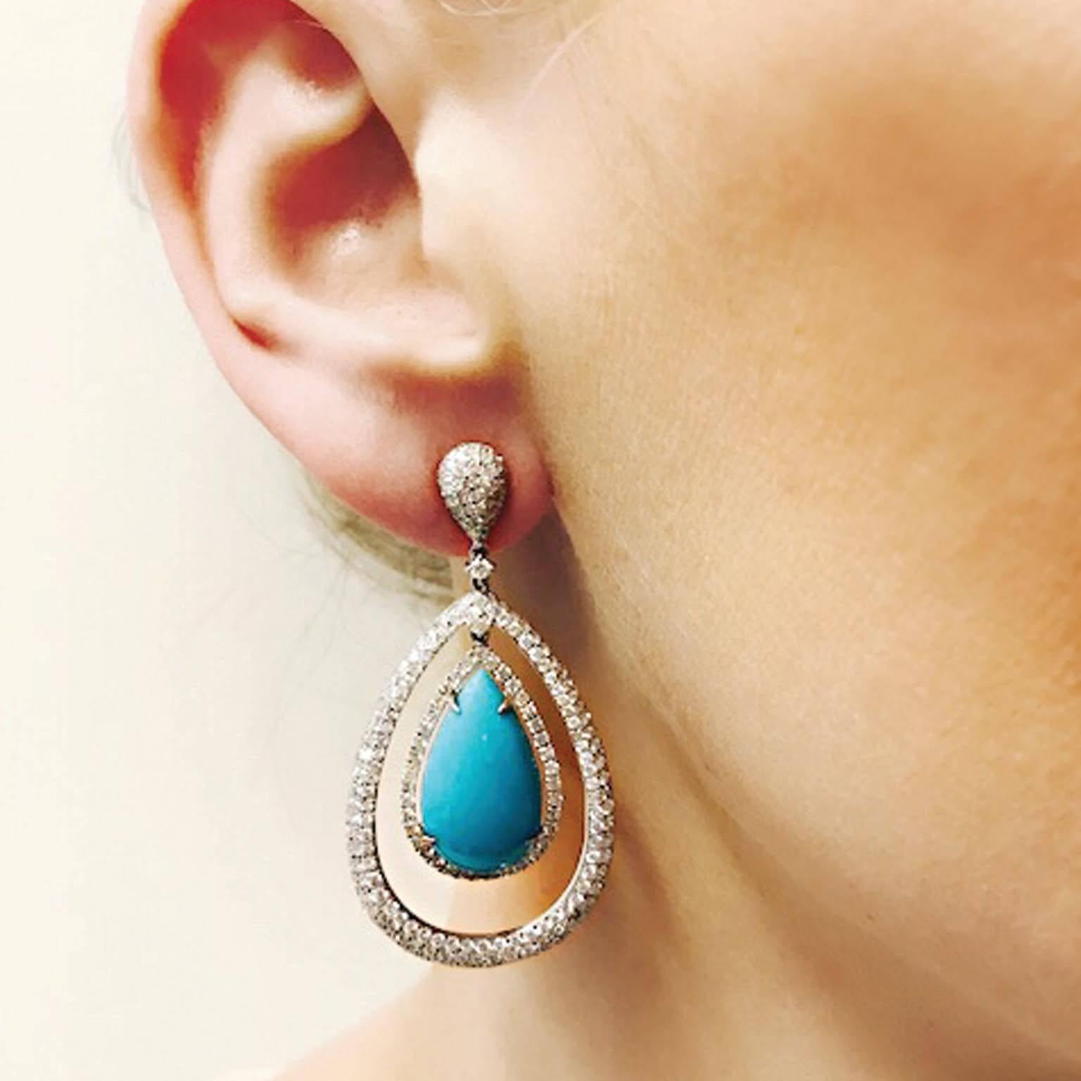 These stunning pear shaped Turquoise and Diamond Pave Earrings are an extreme classic.  Post Earring with butterfly clutch back.

Diamond-  approx. 3.99ct
Turquoise - approx. 13.61ct

48mm in Length