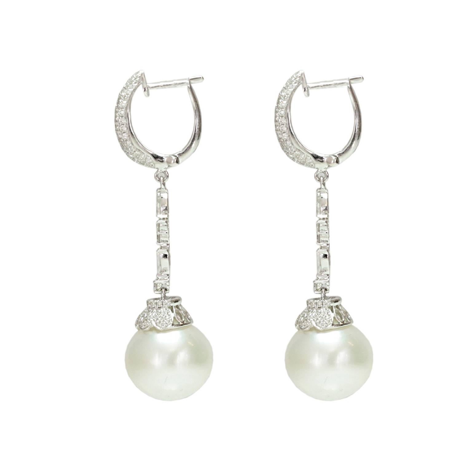 This elegant south sea pearl drop earring contains approx. 1.7ct of Diamonds with two 13.5mm pearl drops. 

48mm in length
Post / Lever Back