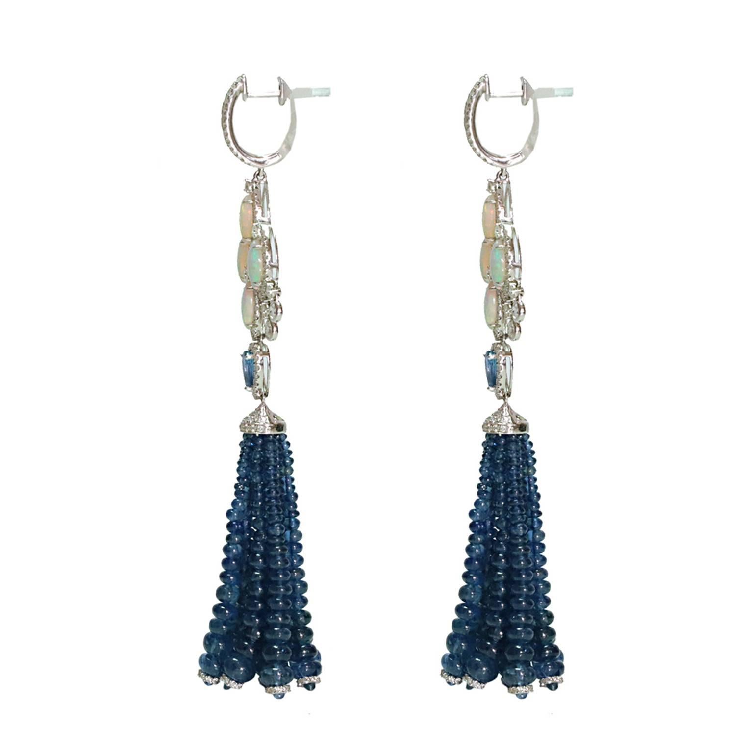 Tassels are one of the biggest trends this season and these Ethiopian Opal Blue Sapphire Diamond Tassel earrings will not disappoint!  Containing 3.01cts of Ethiopian Opal, 1.06cts of Blue Sapphire with 111cts of Blue Sapphire Beads for the tassel