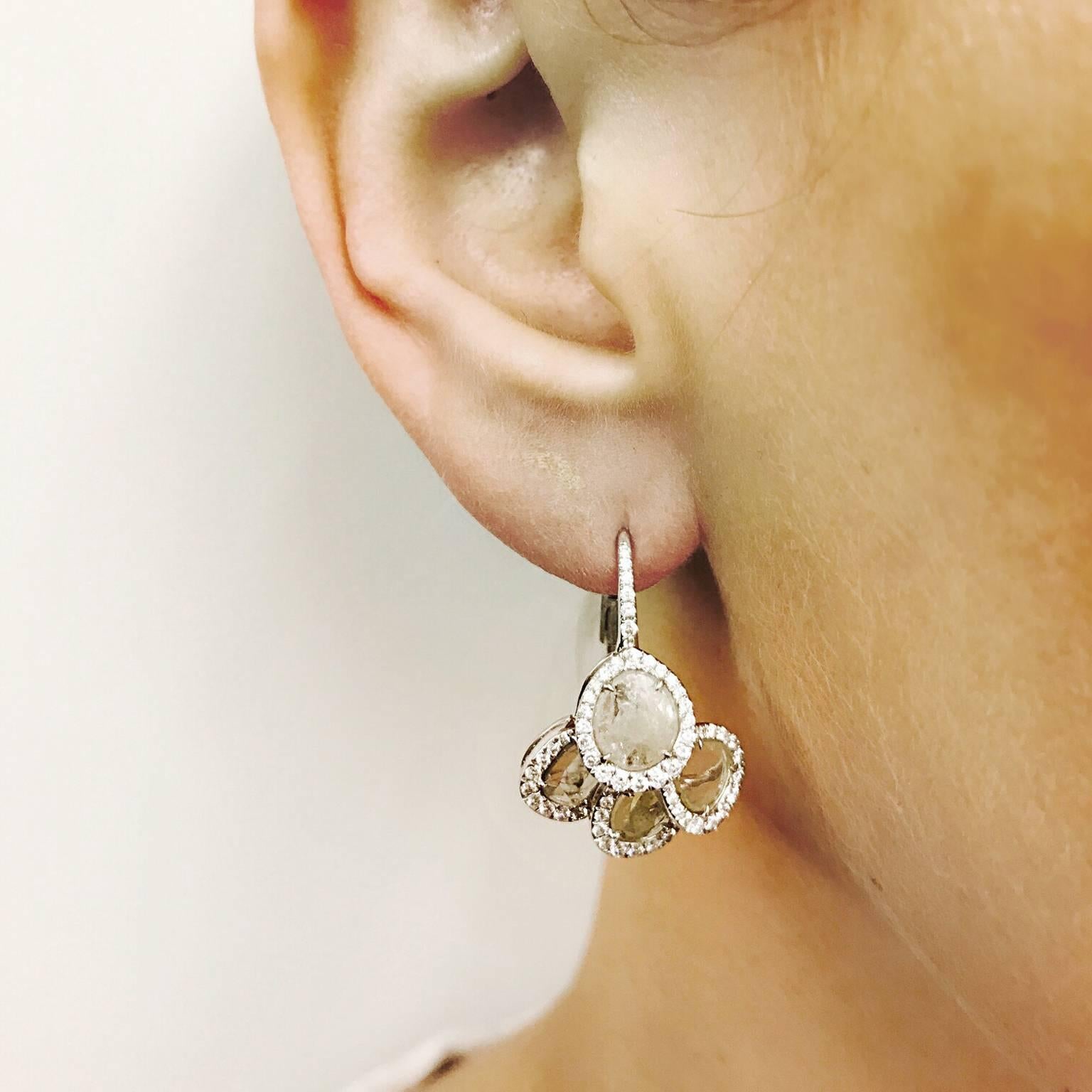 These delicate lever back earrings are a win-win!  There is approx. 1.82cts of sliced diamonds with approx. .77cts of pave diamonds.

23mm in length