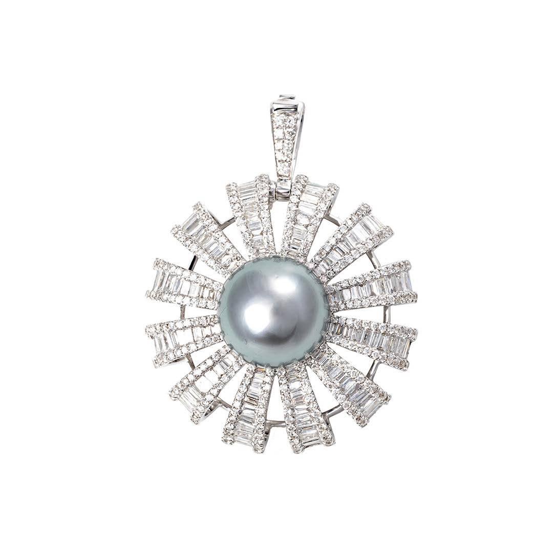 This 18k white gold classic Tahitian Pearl and Diamond Baguette Flower Ring can be easily transformed into a pendant.  The ring shank can easily be taken off and an enhance clip will flip up for you to slide on the chain of your choice! 

Diamond