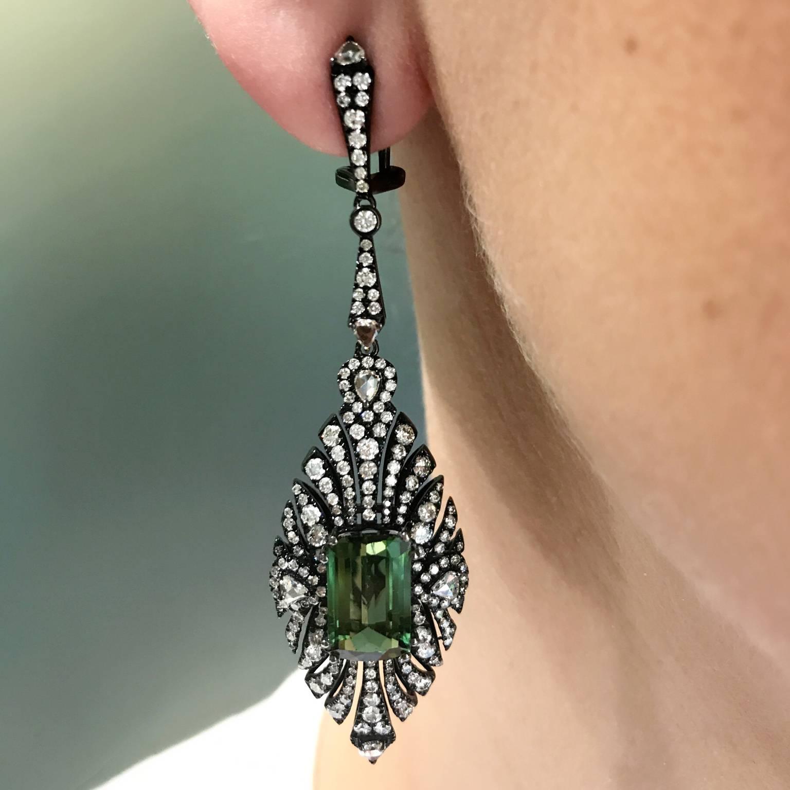 18k Black Rhodium Green Tourmaline (7.5x12mm, 7.80 total carat weight) Centers surrounded by 4.35 total Carats of Diamonds. Omega Clip / Post

70mm in Length
19mm in Width