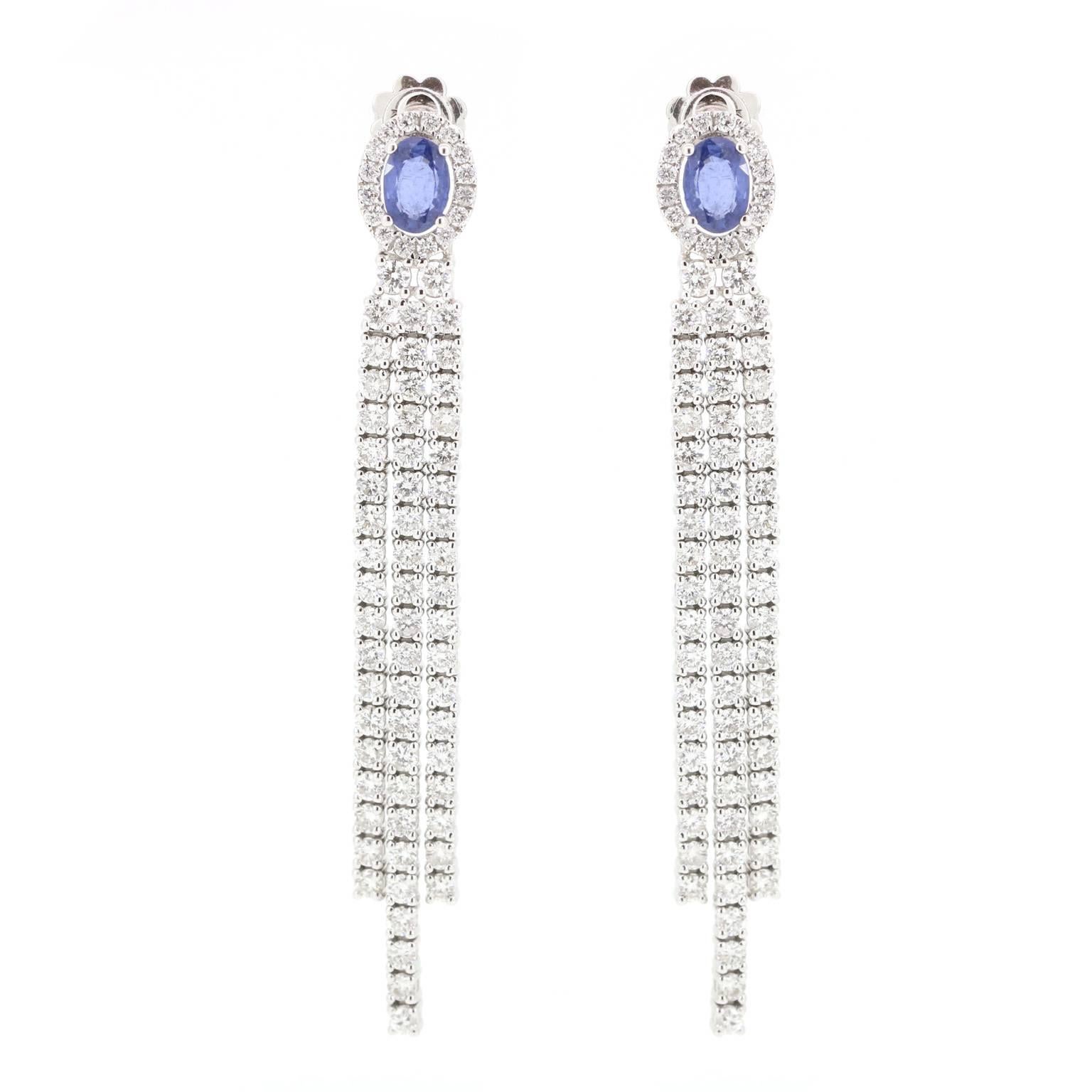 Elegant Blue Sapphire and Diamond linear drop earring is the perfect black tie earring.  Wear your hair up to show off the magnificent sparkle.

Blue Sapphire - 1.96 carats
Diamonds - 4.64 carats
Post / Clutch back

Length - 65mm
Width - 8mm